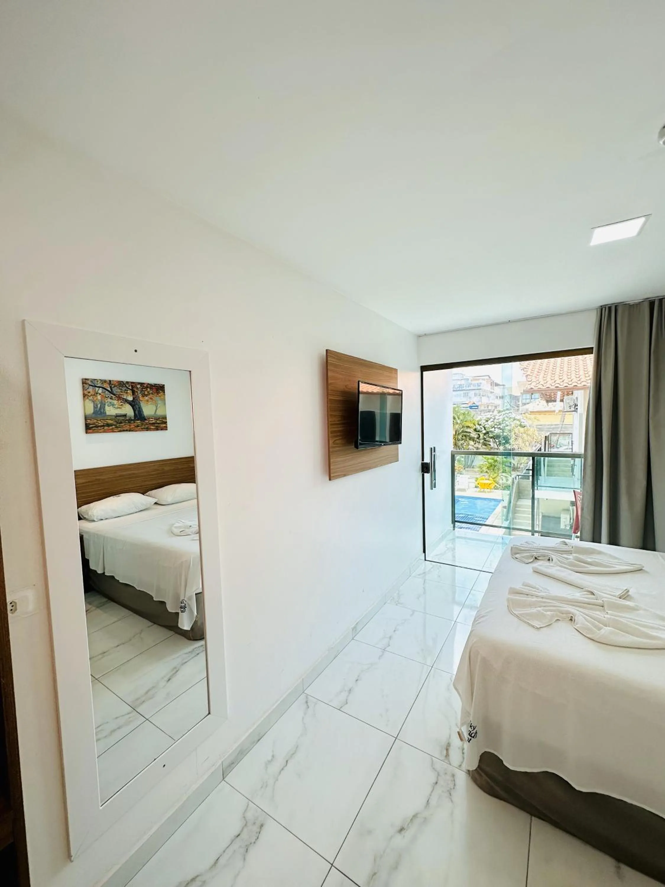 Bed in Pousada Sky Beach Flat