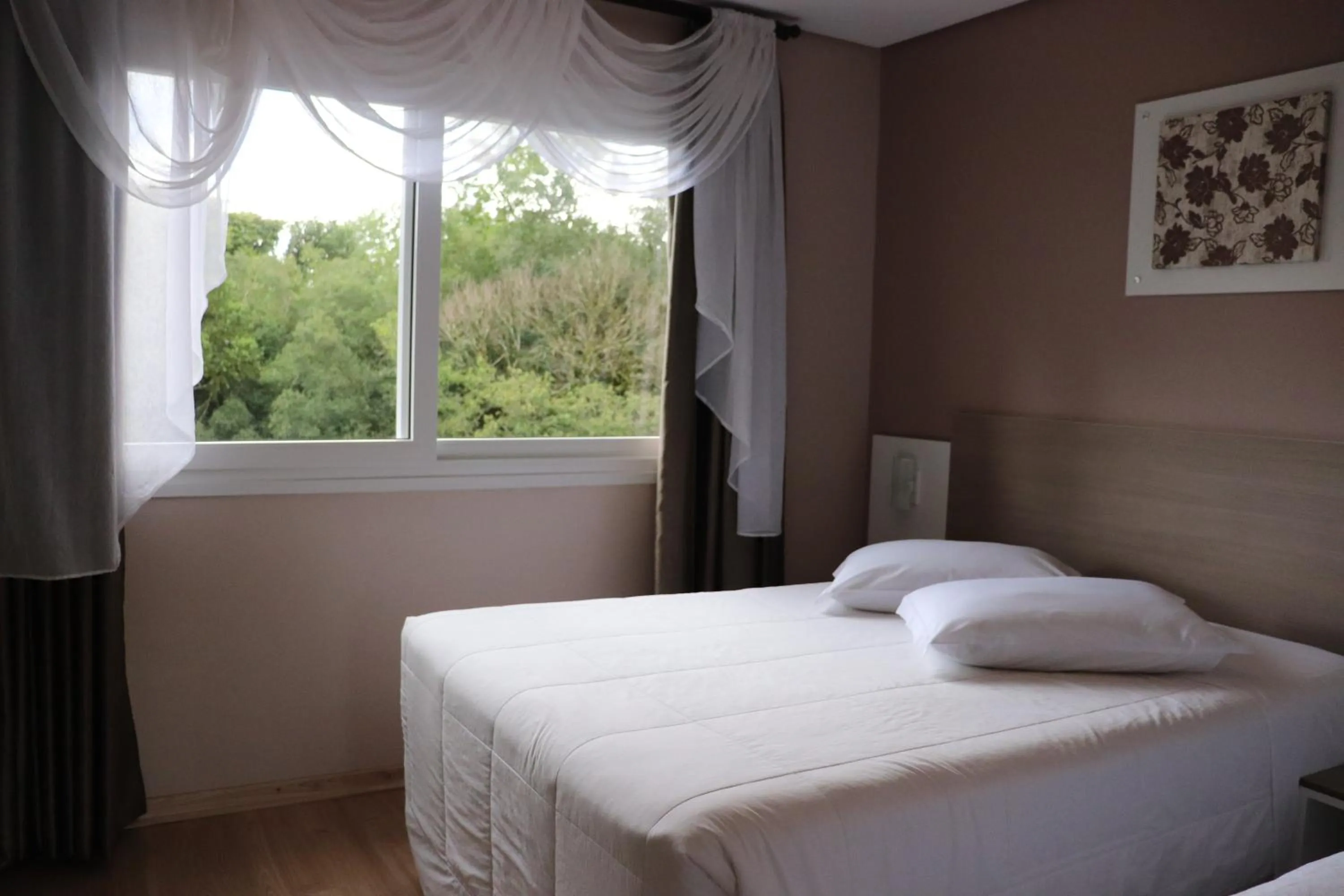 Bed in Pousada Vovô Nino