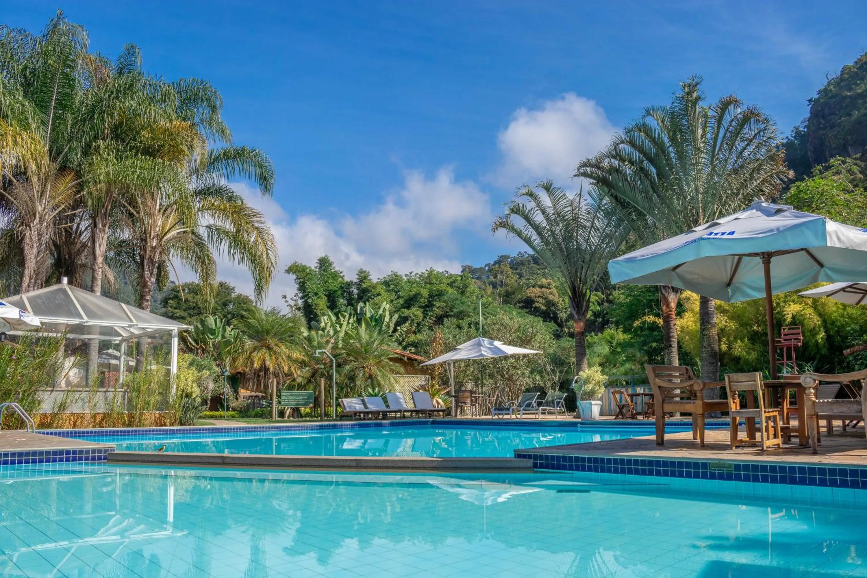 Swimming pool in Bomtempo Itaipava by Castelo Itaipava