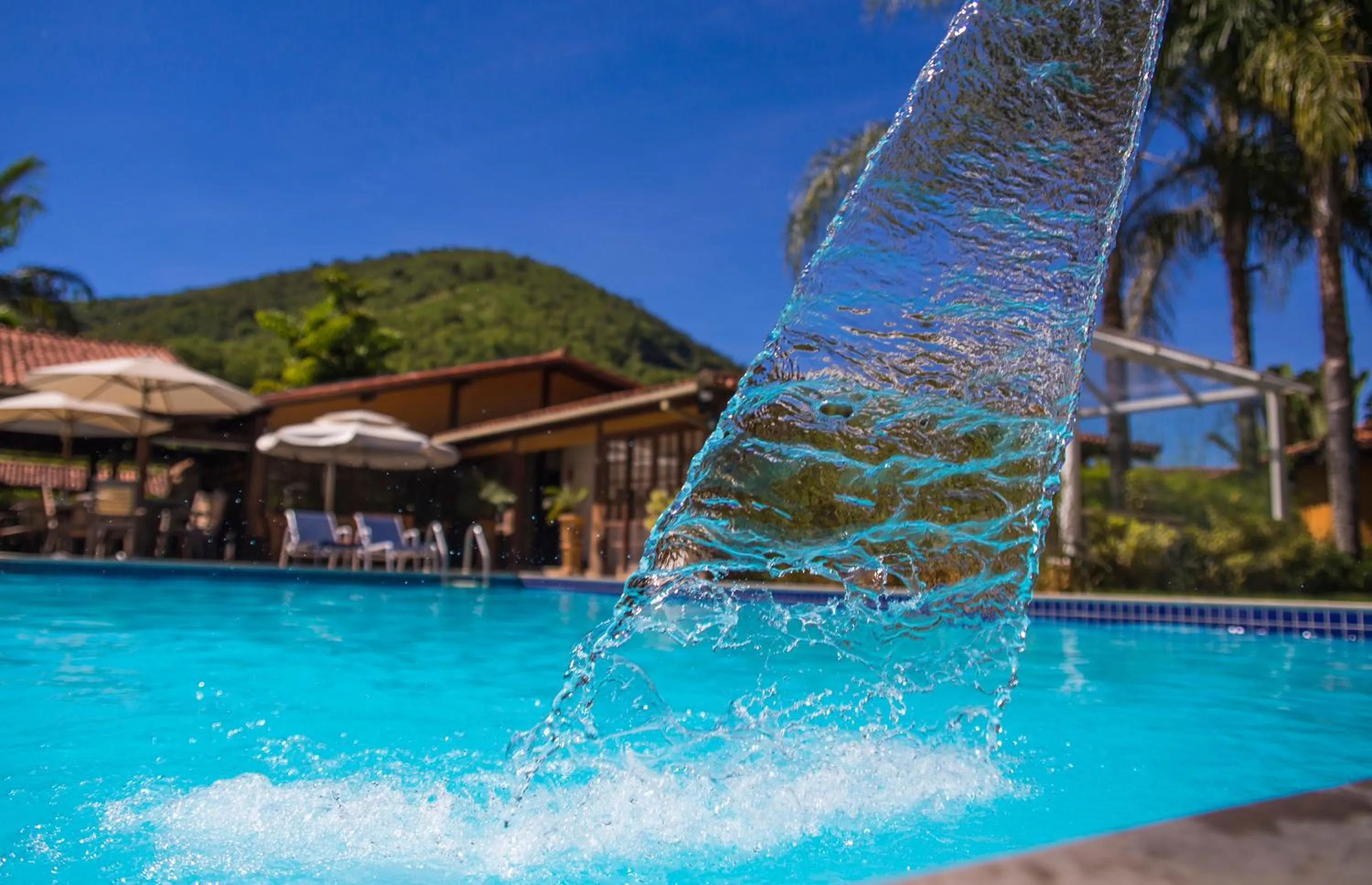 Swimming pool in Bomtempo Itaipava by Castelo Itaipava