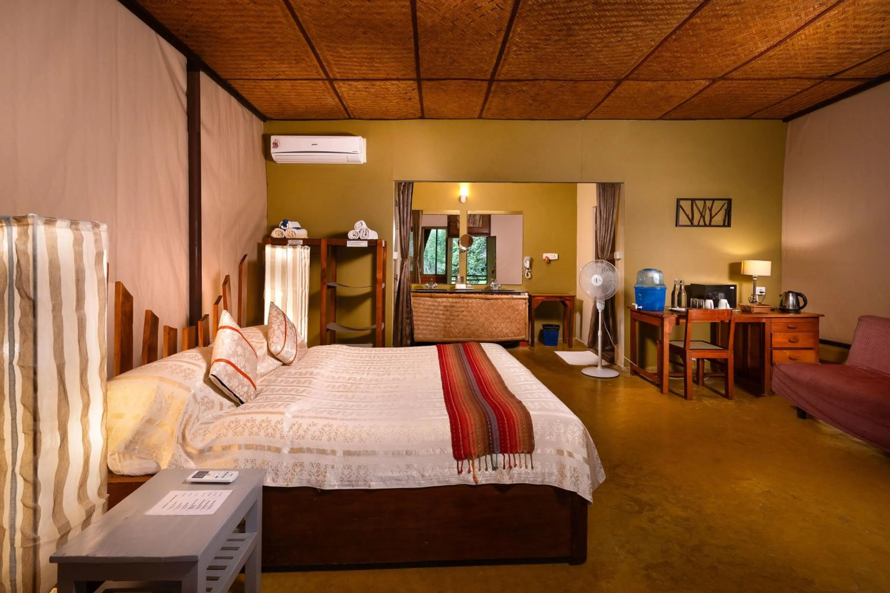 Bed in Jungle Hut Resort