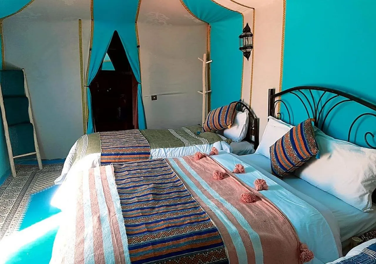 Bed in Merzouga Luxury Camp