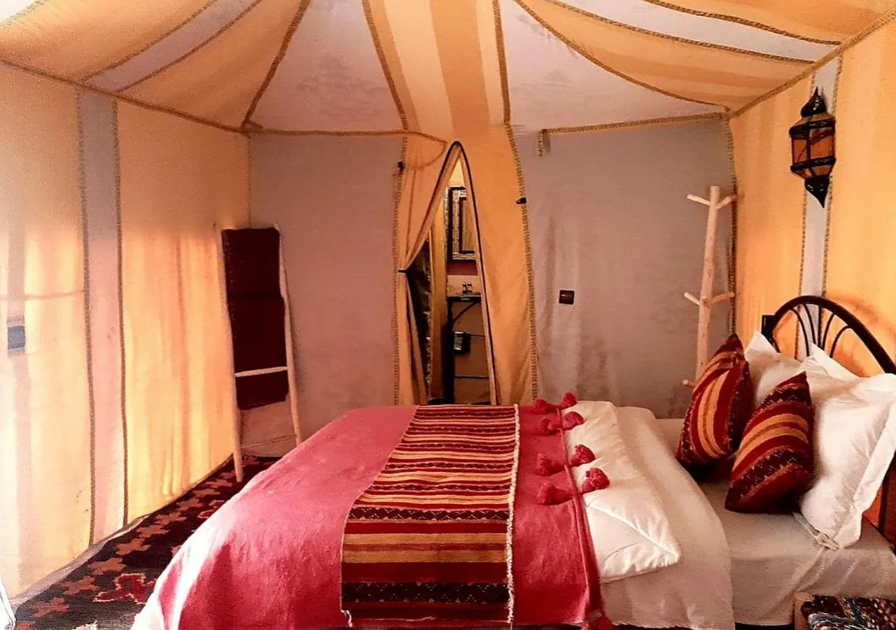 Bed in Merzouga Luxury Camp