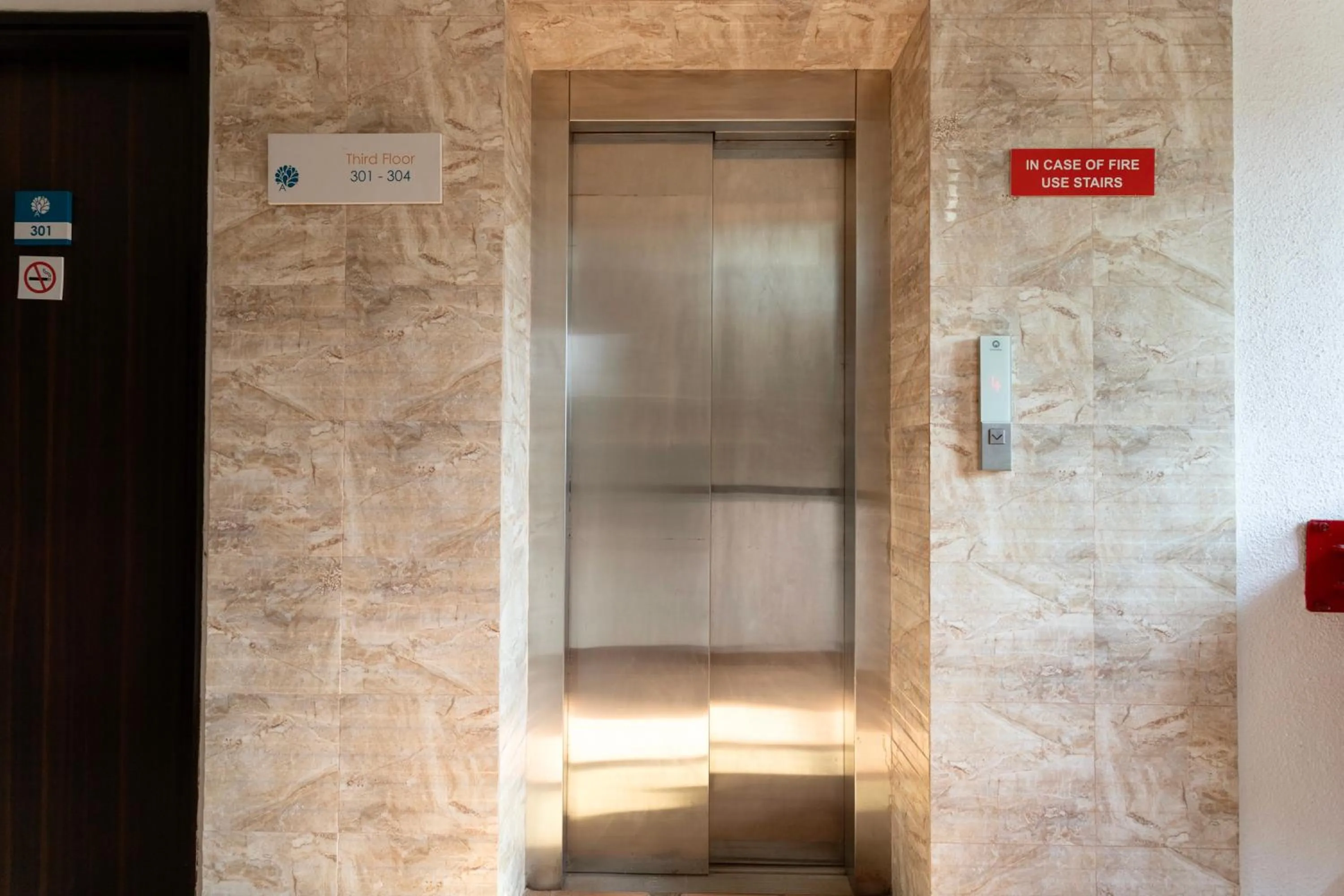 elevator in Arotel Rooms & Suites