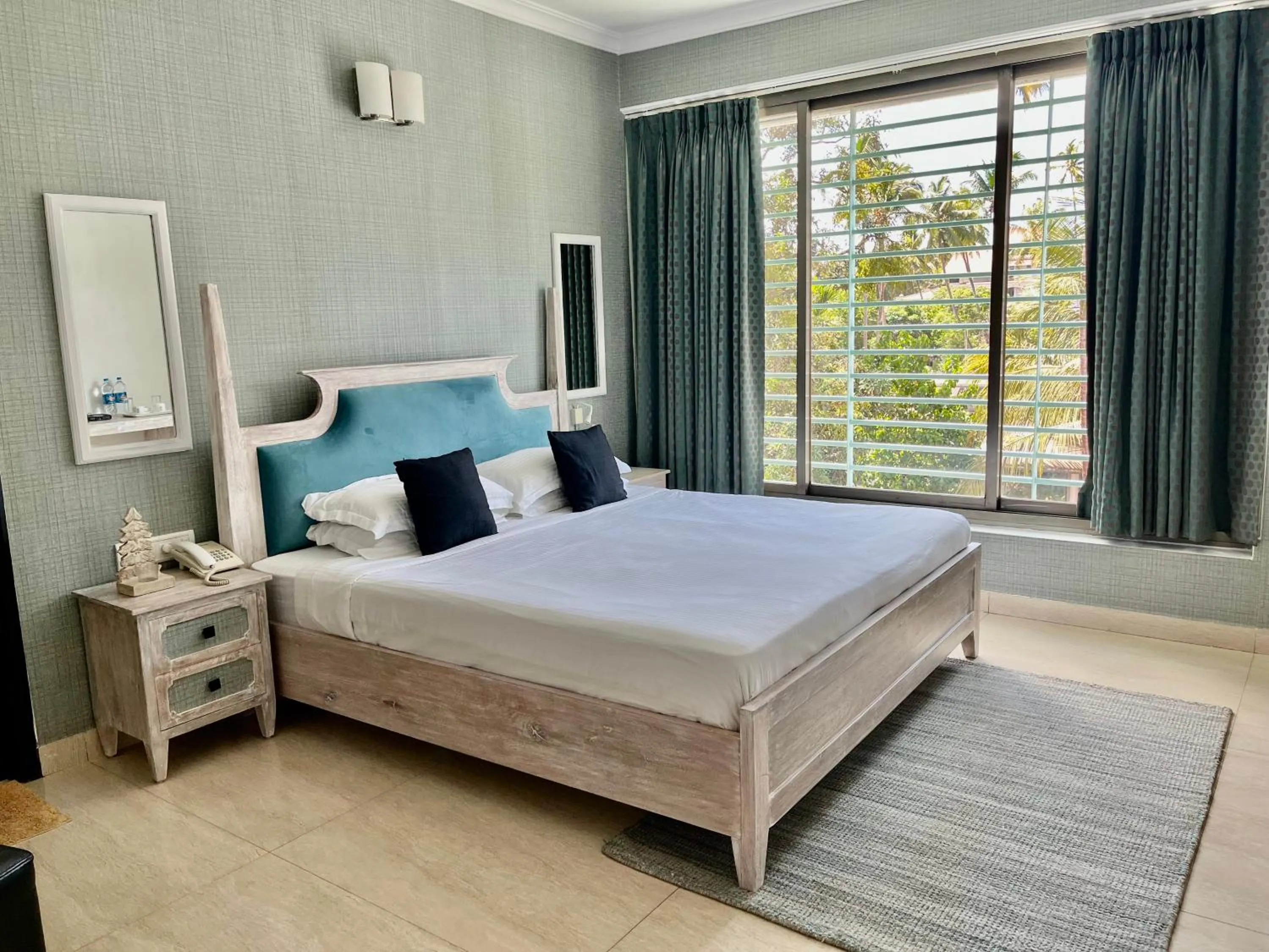 Bed in Arotel Rooms & Suites