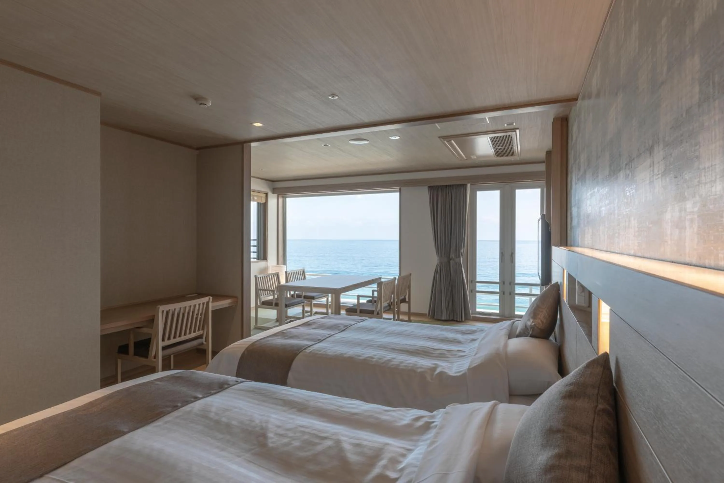 Bed in Kamogawa Grand Hotel