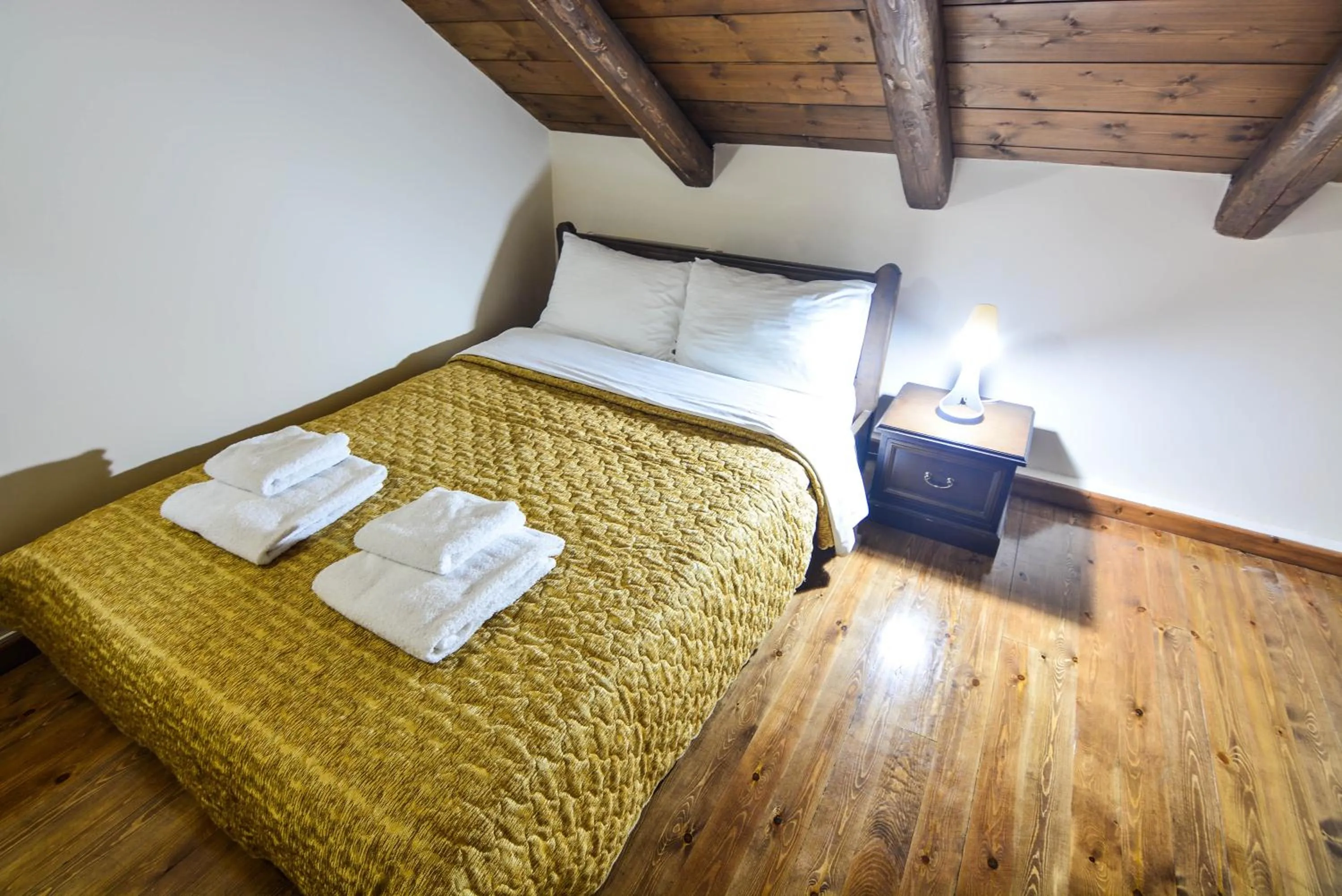 Bed in Hotel Iliovasilema