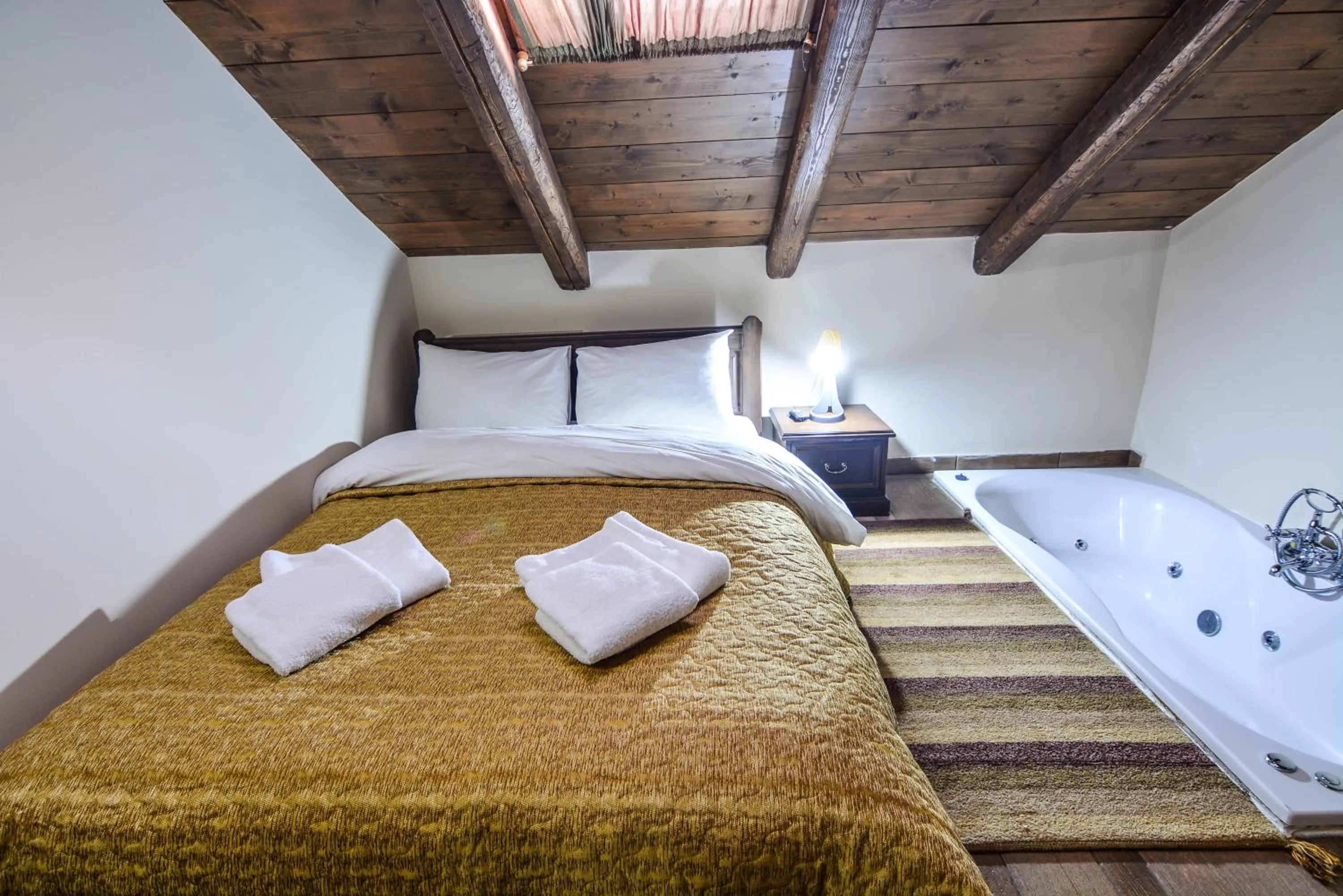 Bed in Hotel Iliovasilema