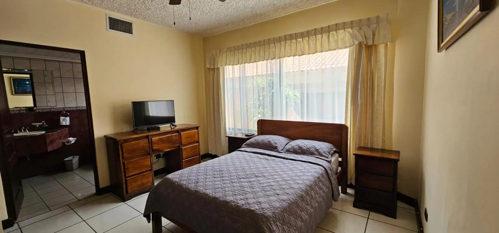 Bed in Apartotel Obelisco San José Aeropuerto