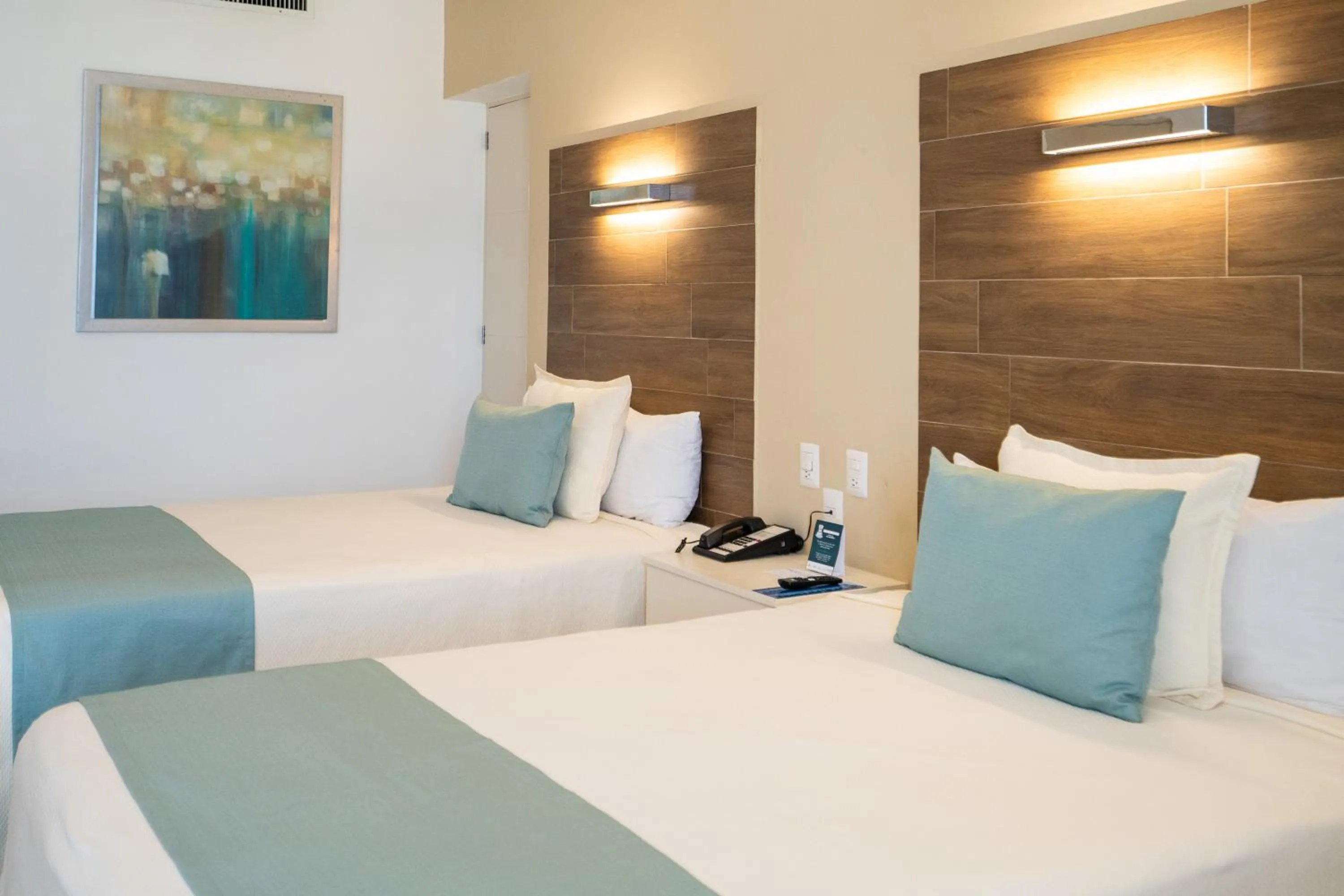 Bed in Pacific Palace Beach Tower Hotel