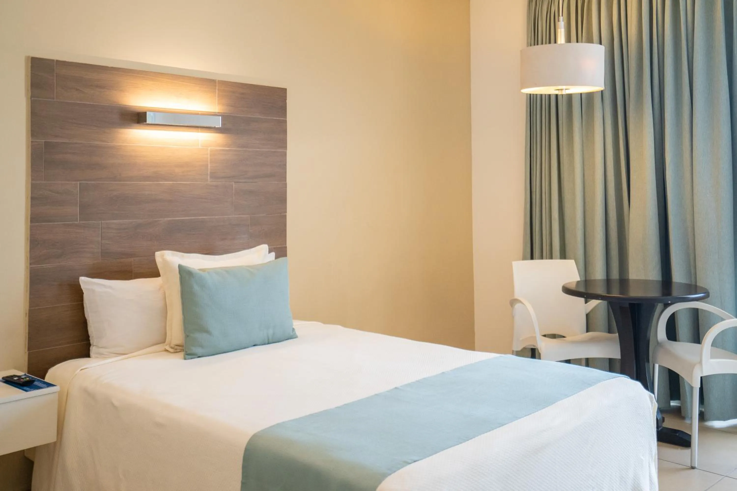 Bed in Pacific Palace Beach Tower Hotel