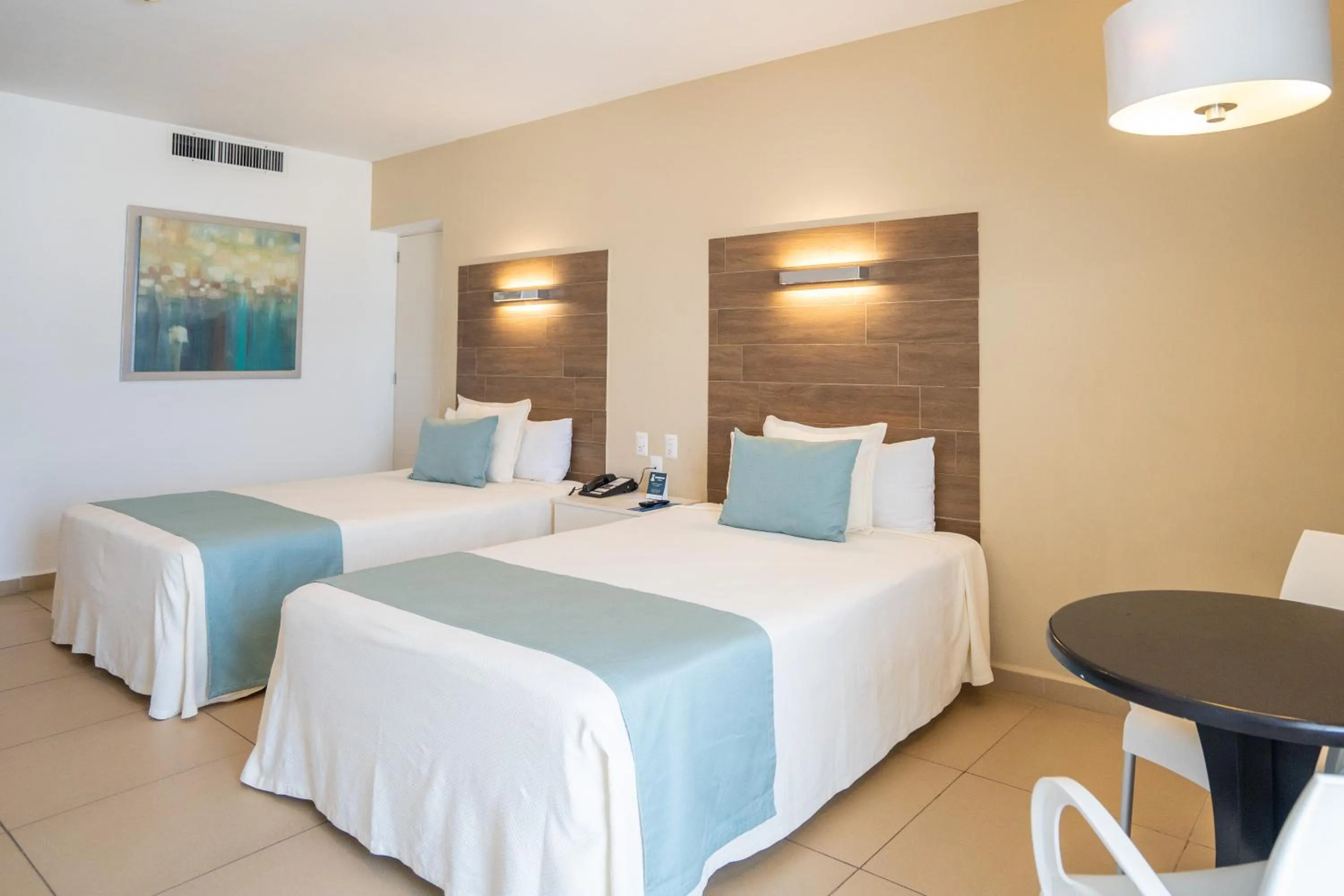 Bed in Pacific Palace Beach Tower Hotel