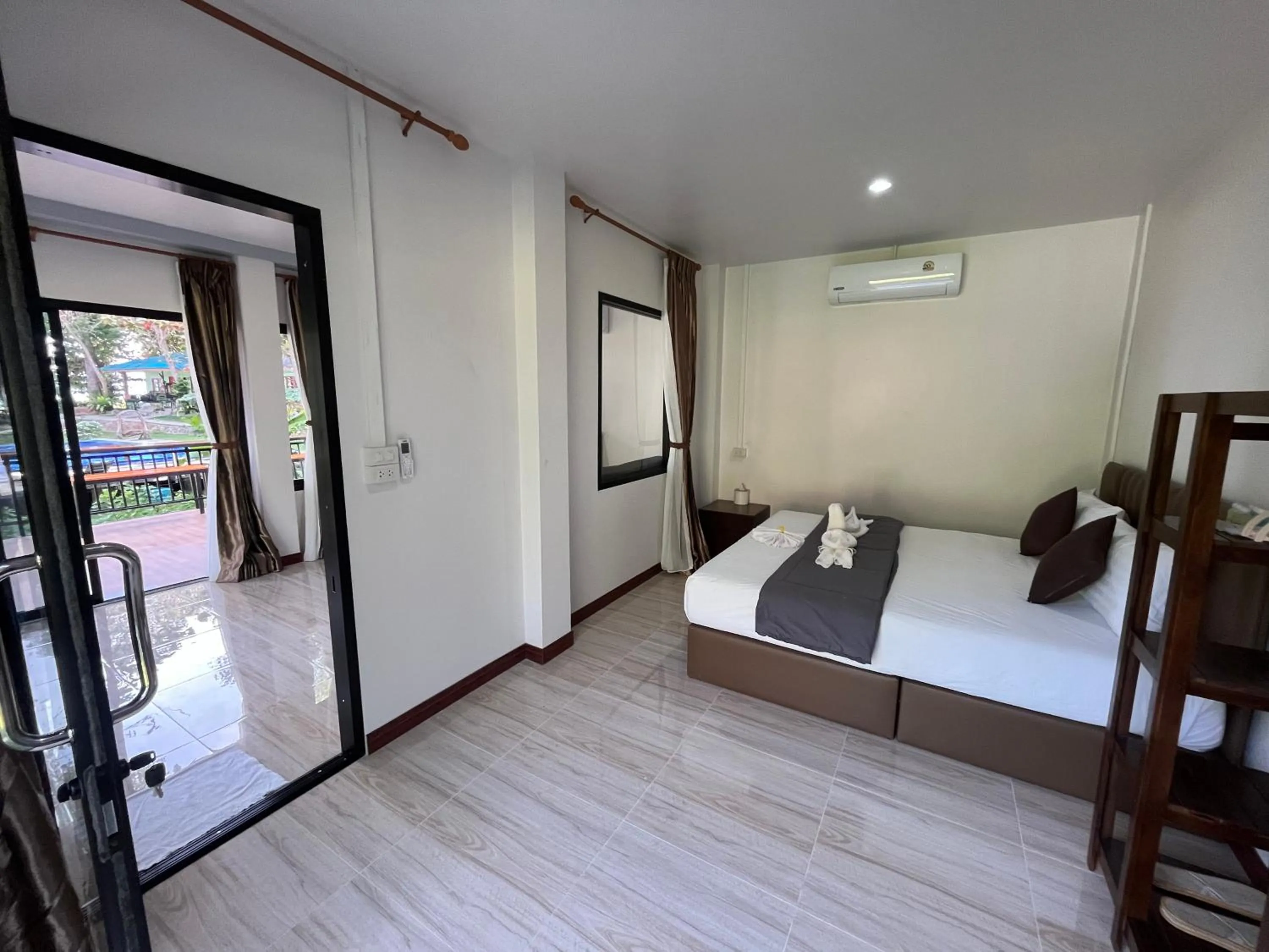 Bed in Koh Mook Garden Beach Resort