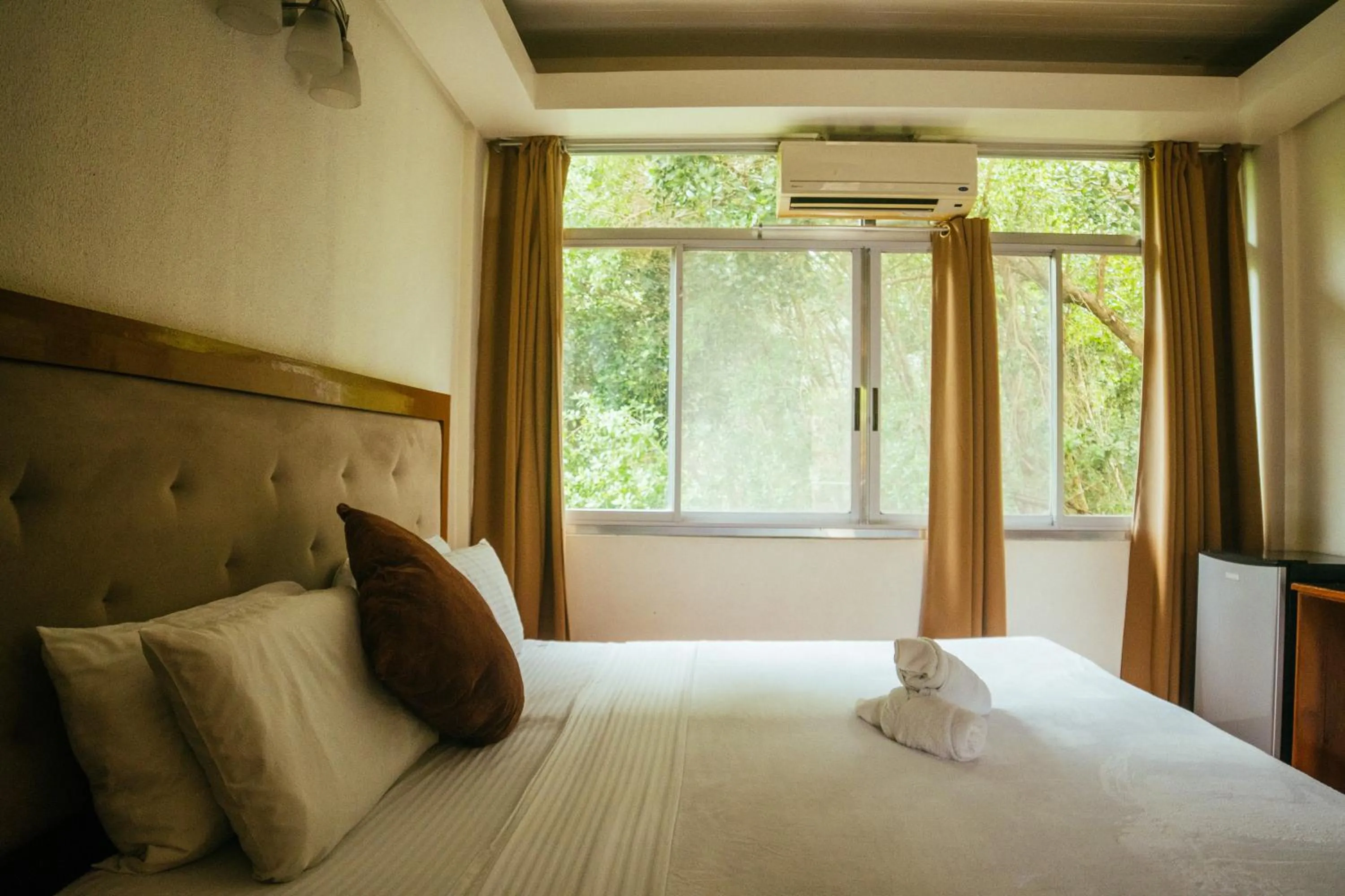 Bed in Marina Palawan Boutique Nature Resort