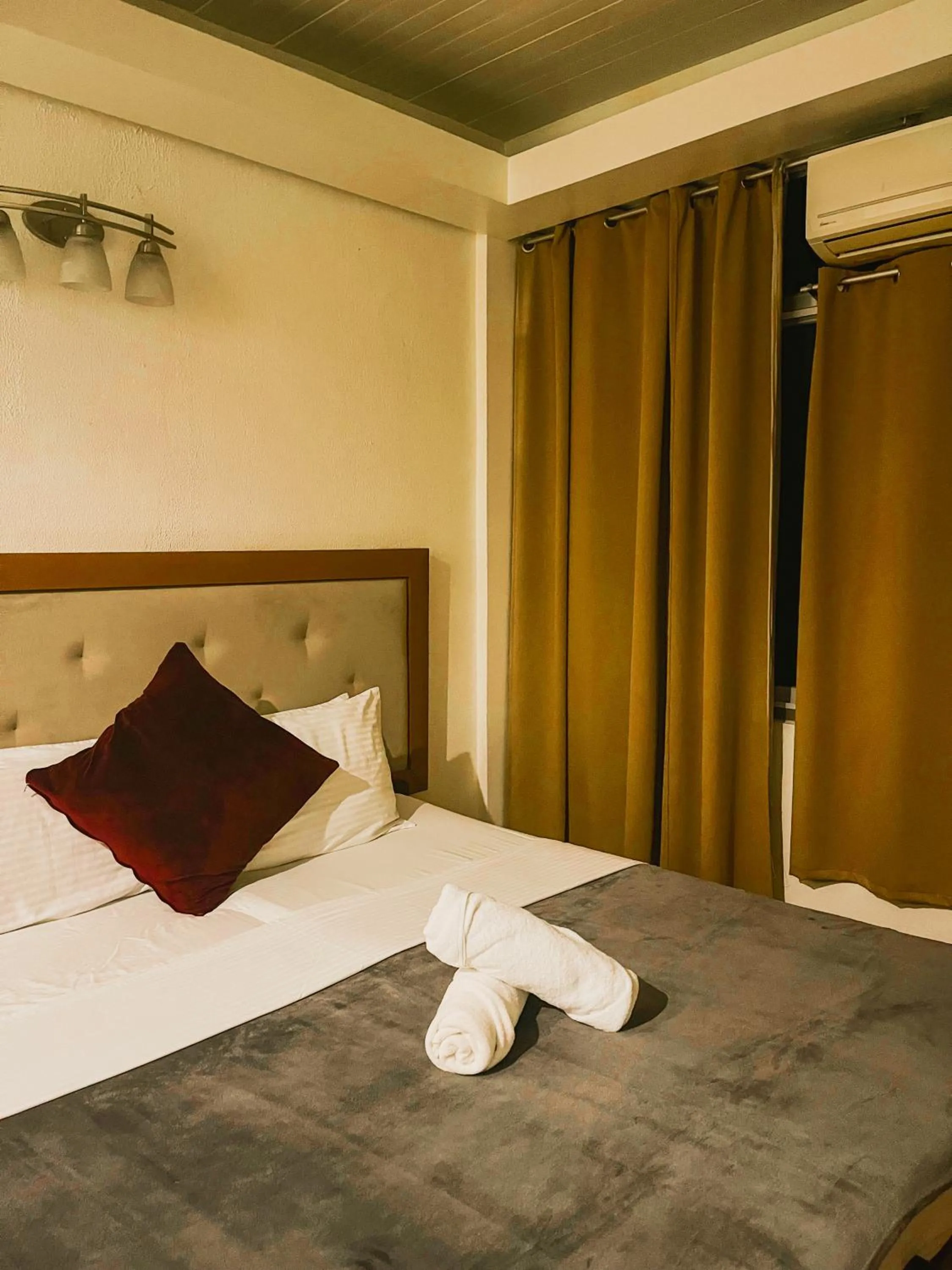 Bed in Marina Palawan Boutique Nature Resort