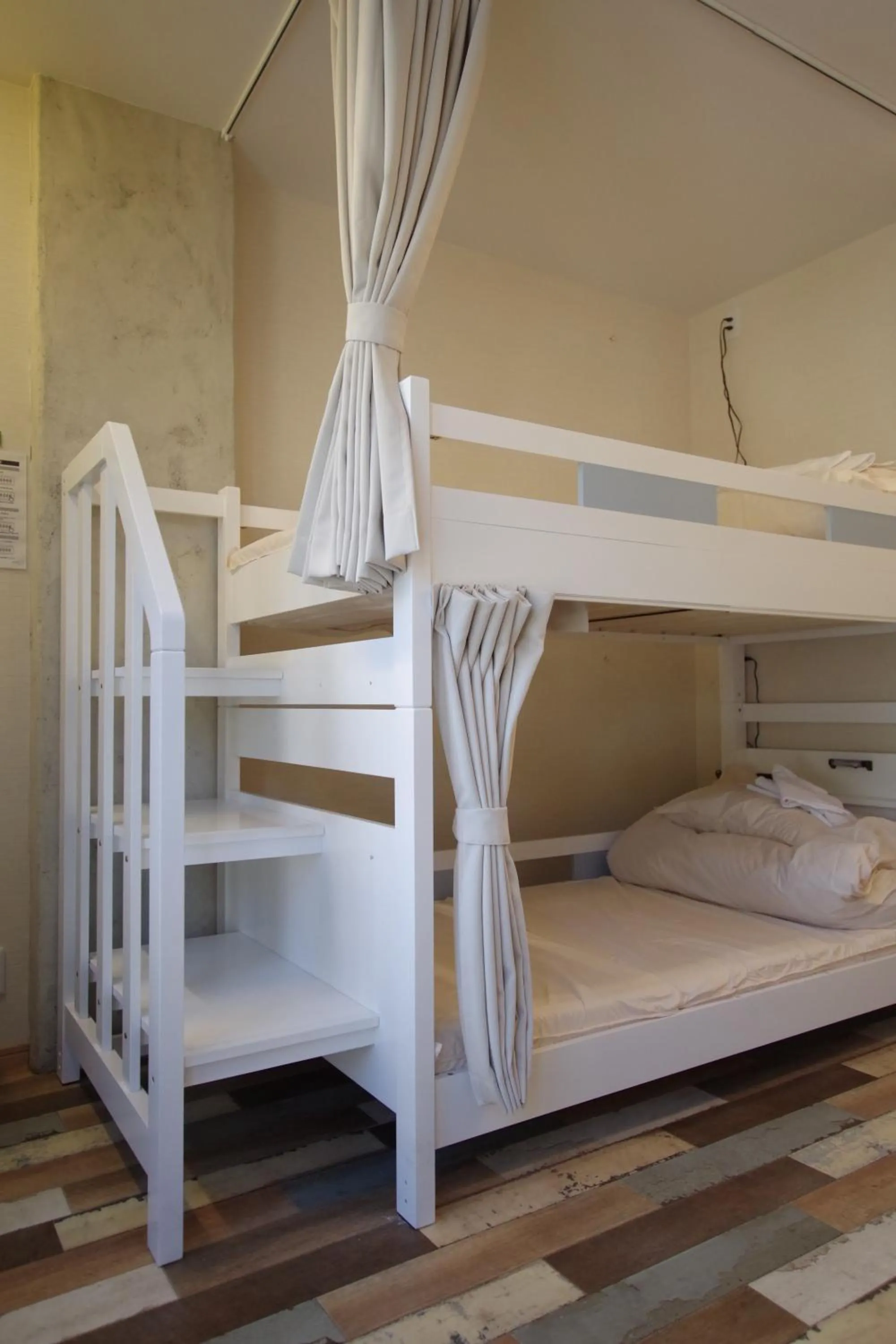 Bed in Cinnamon Guesthouse Dogo