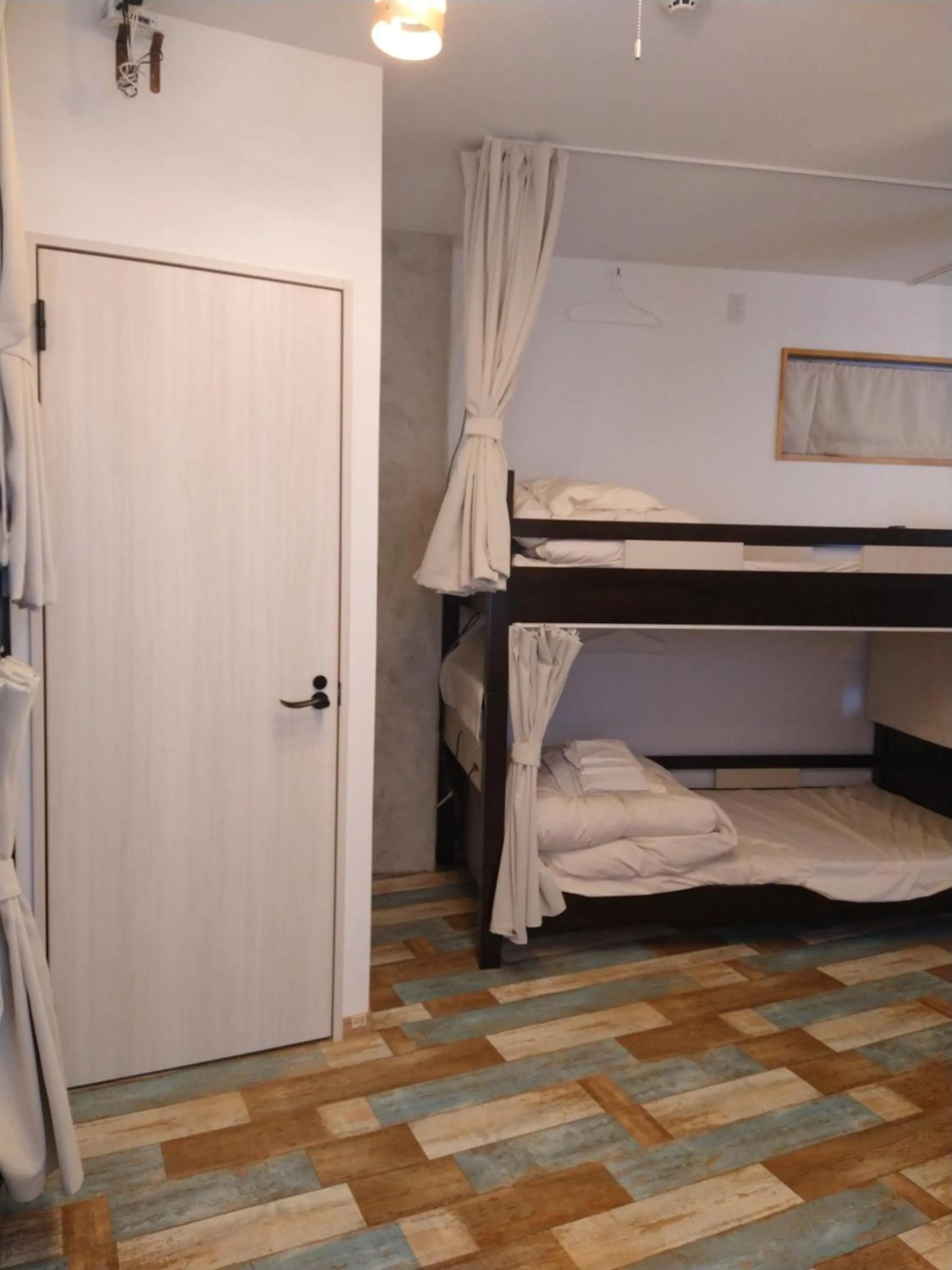 Bed in Cinnamon Guesthouse Dogo