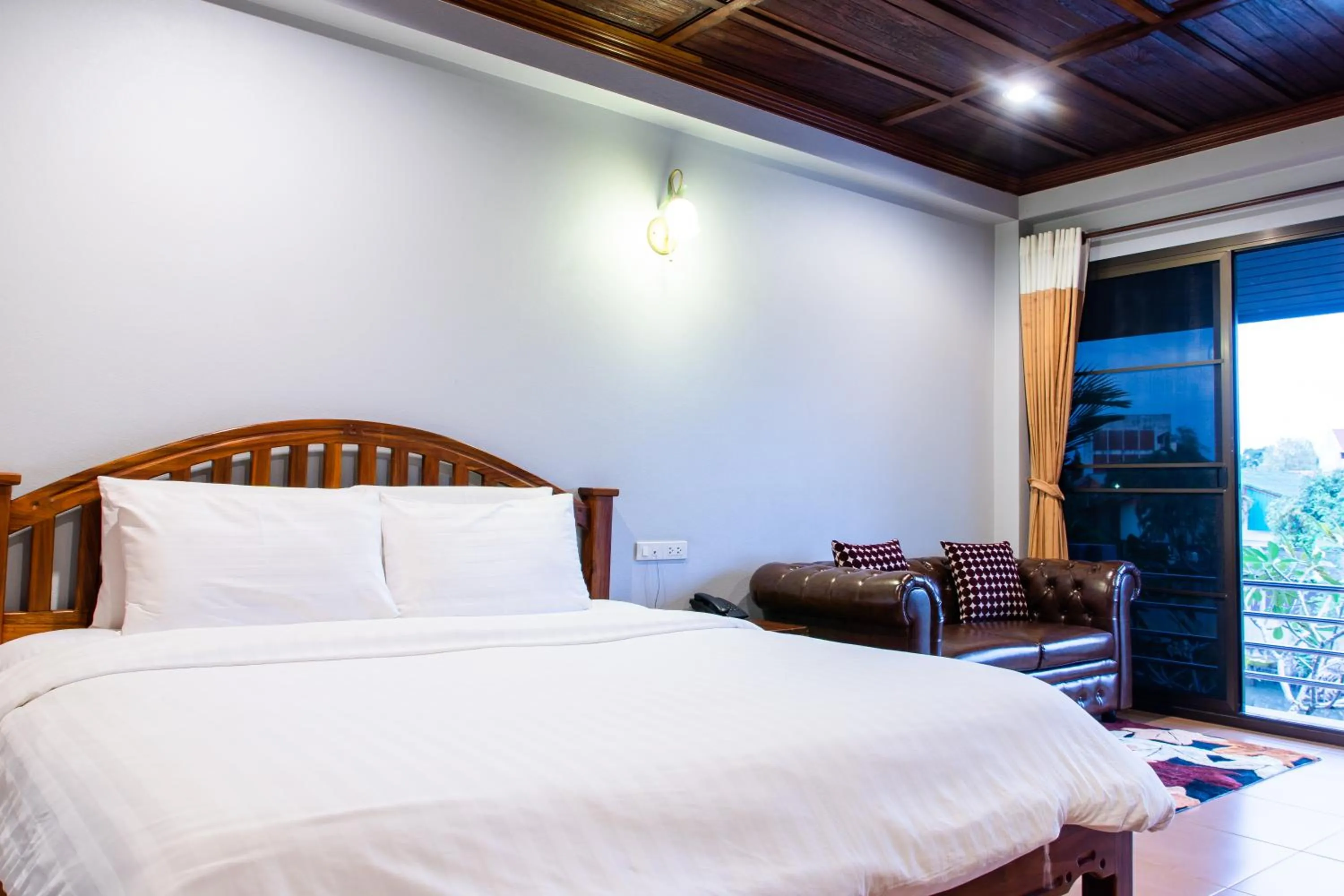 Bed in BaanRimNam Resort Trat