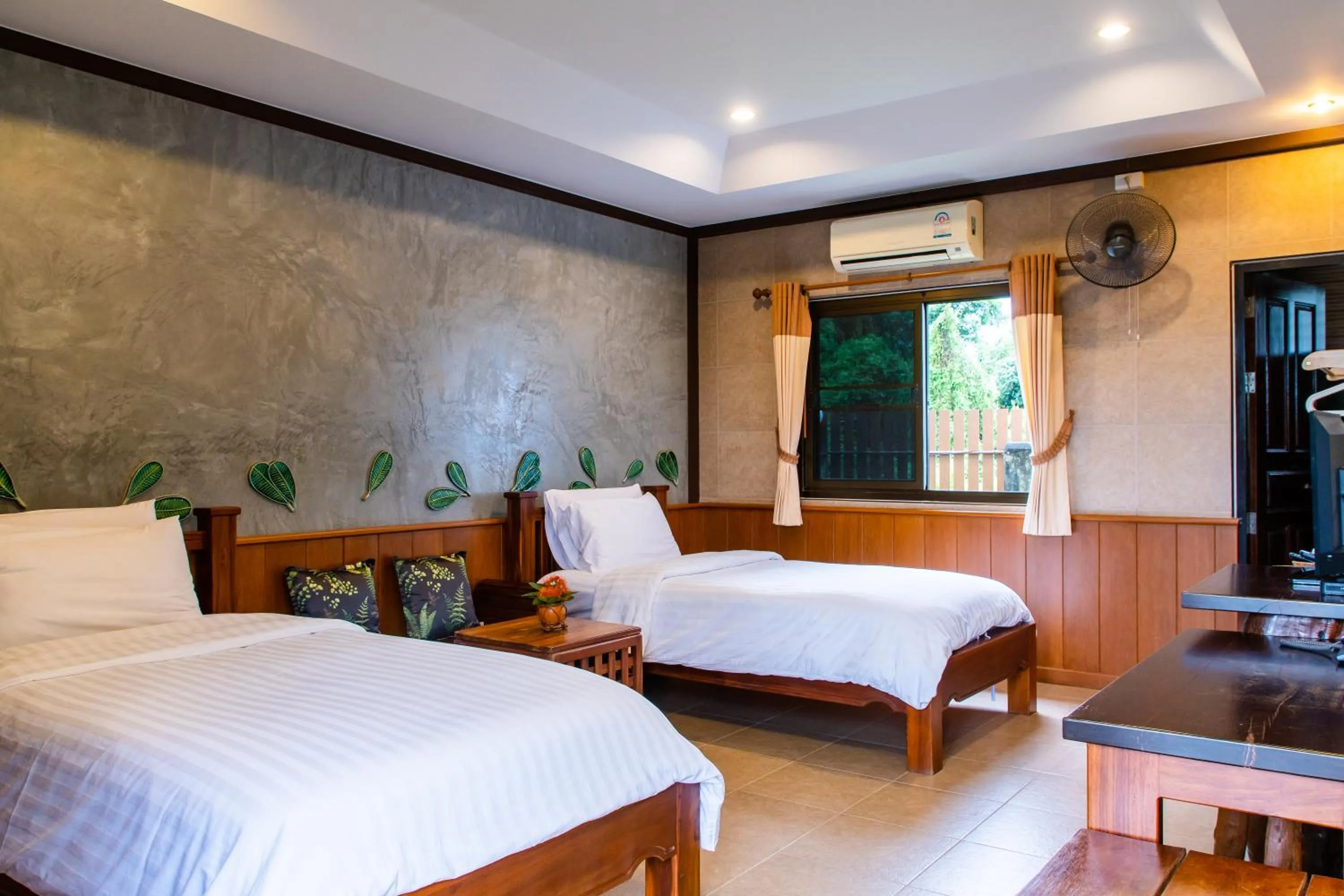 Bed in BaanRimNam Resort Trat