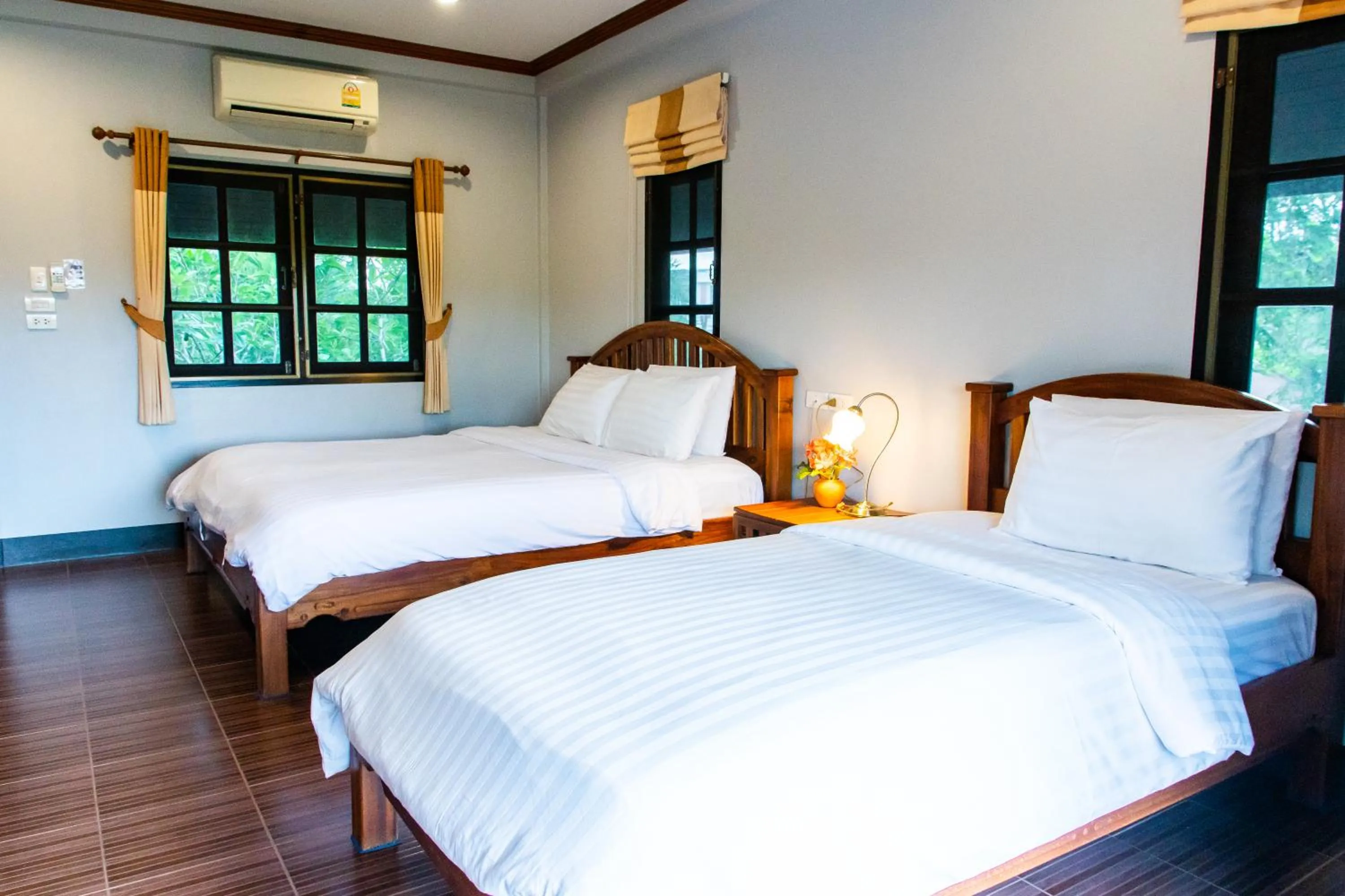 Bed in BaanRimNam Resort Trat