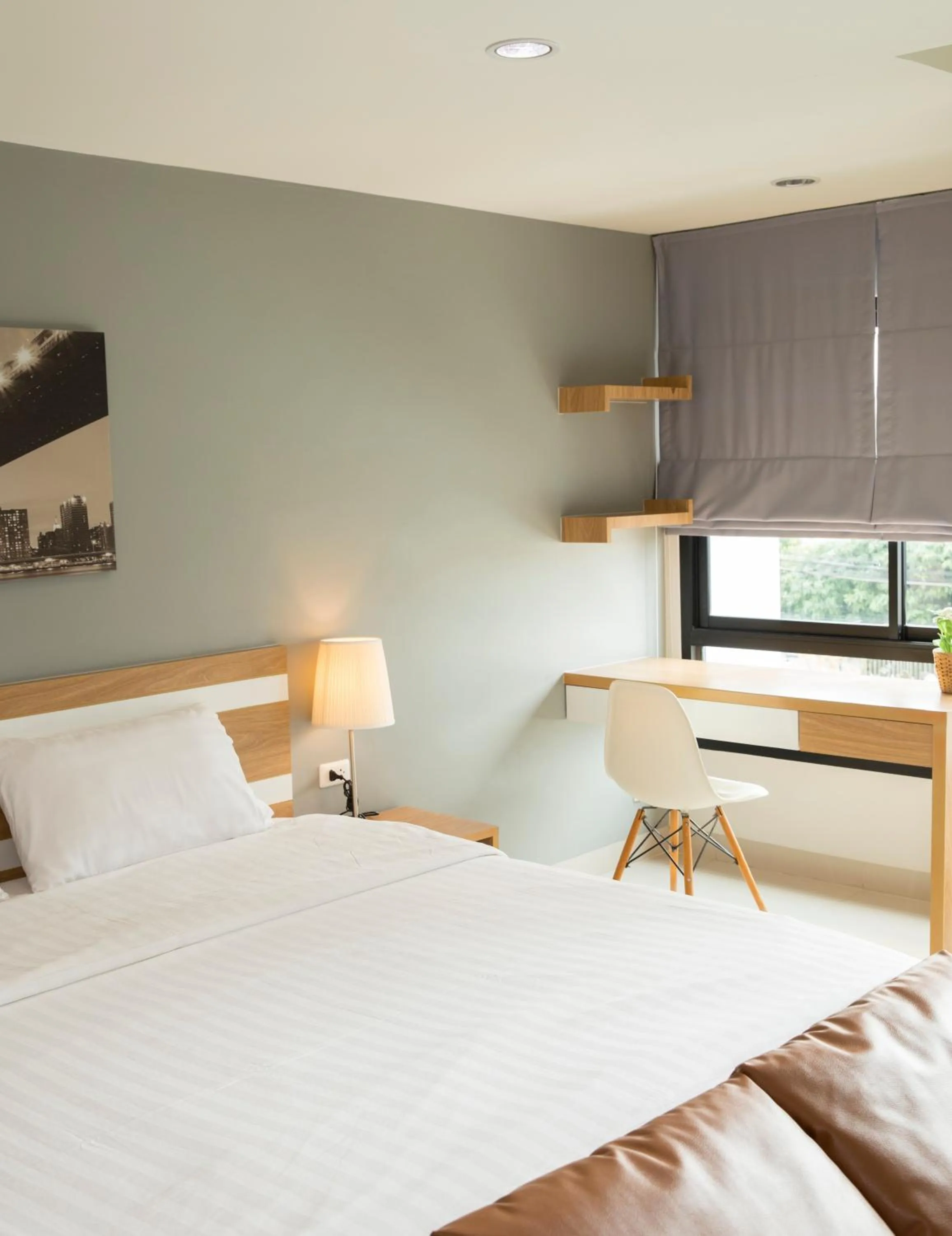 Bed in JK LIVING Hotel And Service Apartment