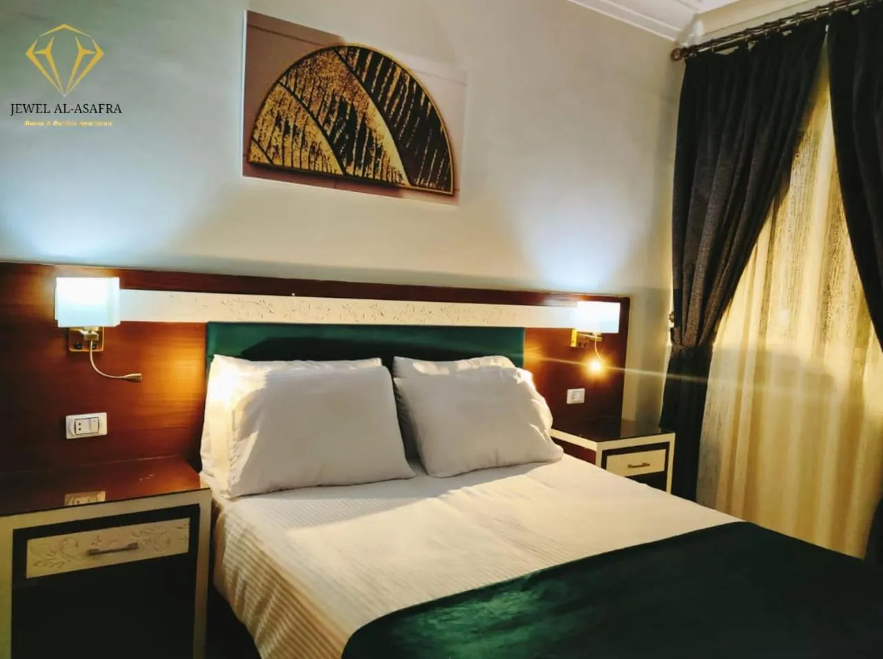Bed in Asafra Hotel Apartments
