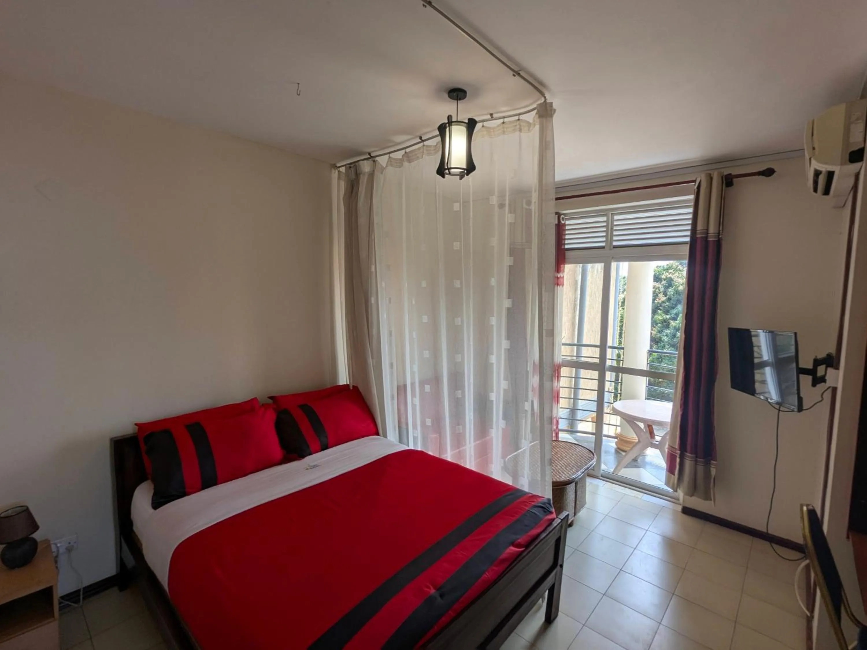 TV and multimedia, Bed in Hotel Royal Nest Entebbe