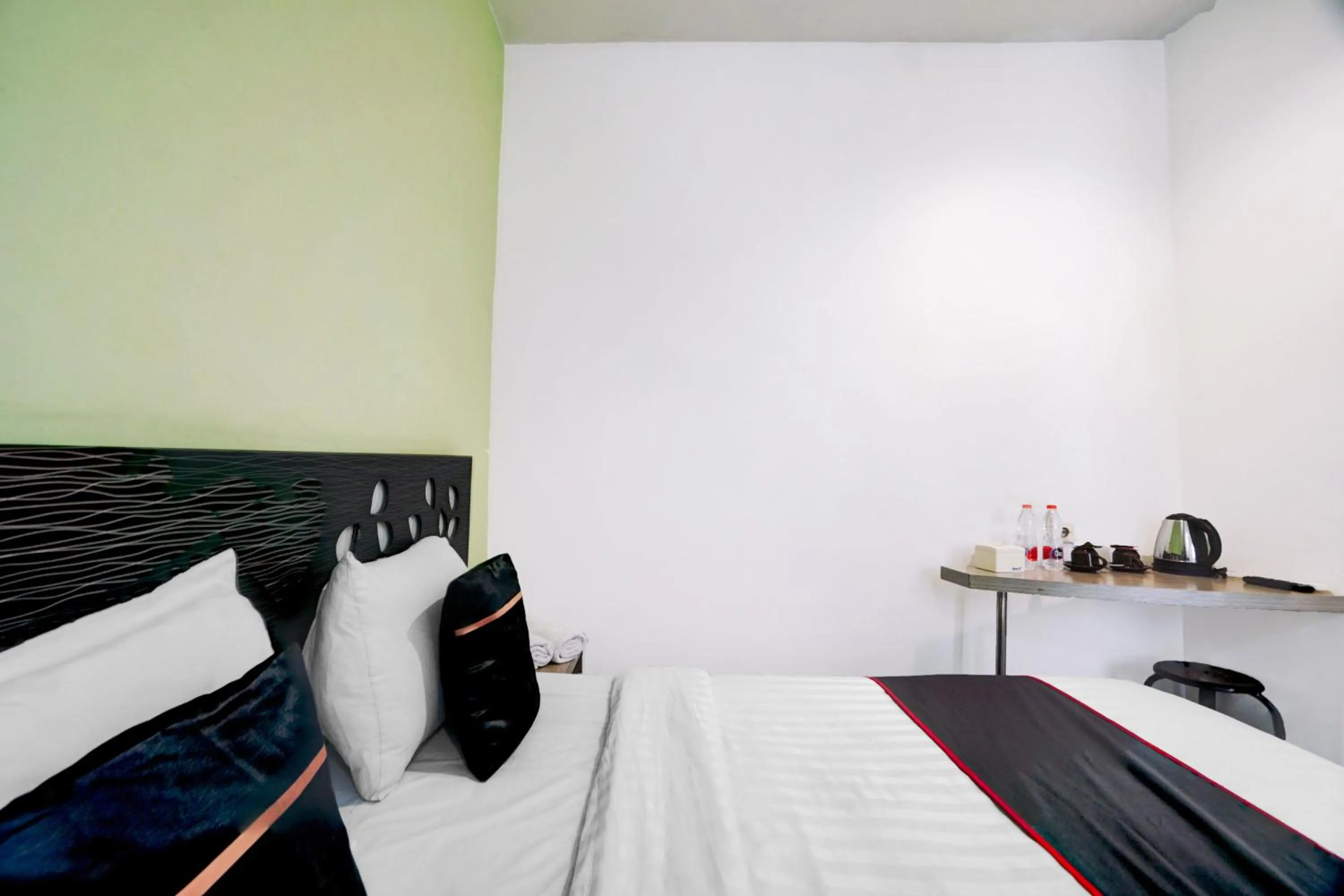 Bed in Hotel O Symphony Homestay Tlogomas