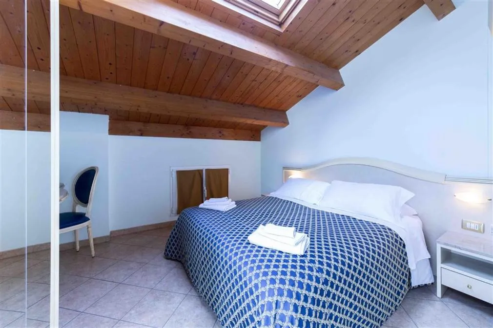 Photo of the whole room, Bed in Residenza Melucci