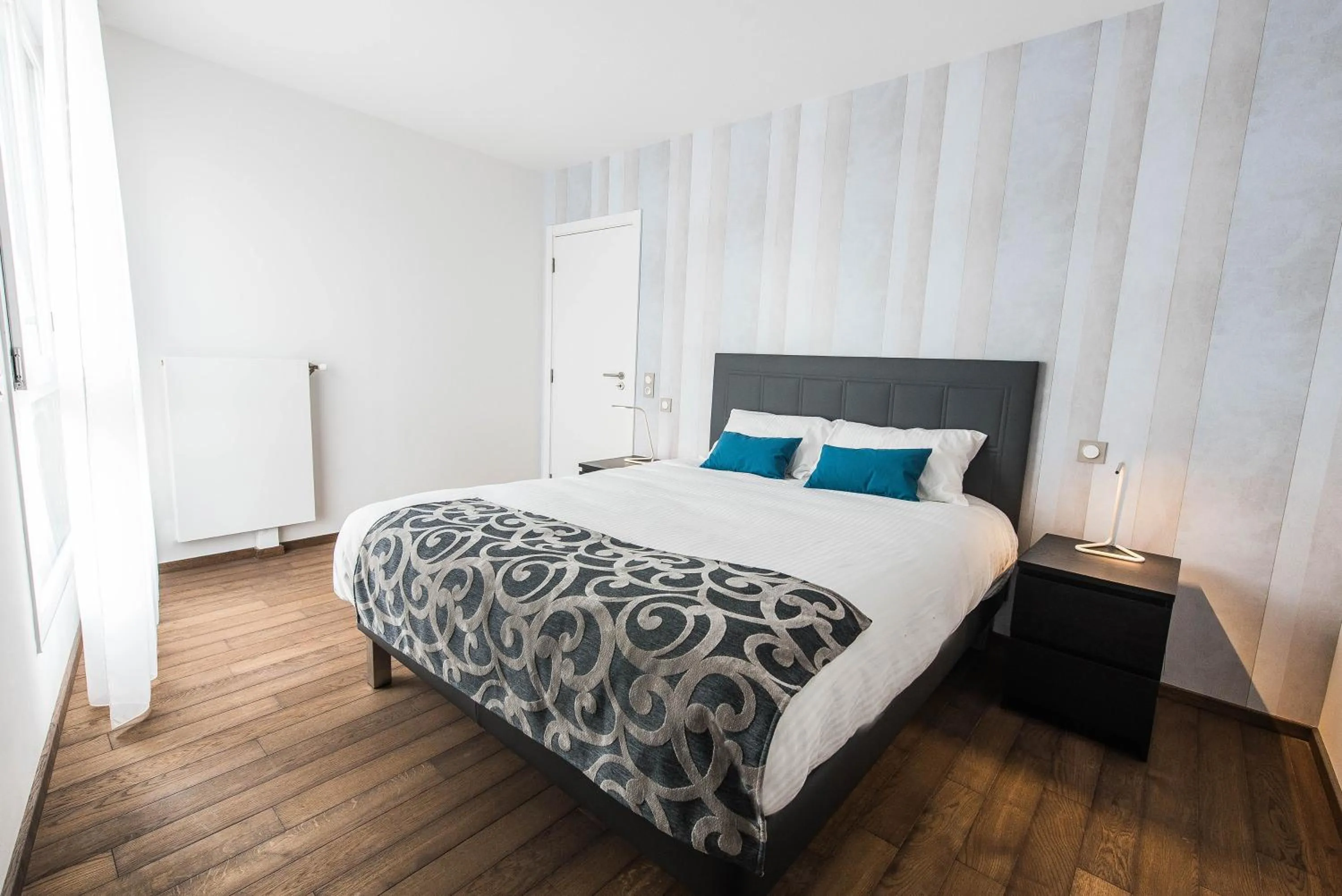 Bedroom in Les Appartements Paris Clichy