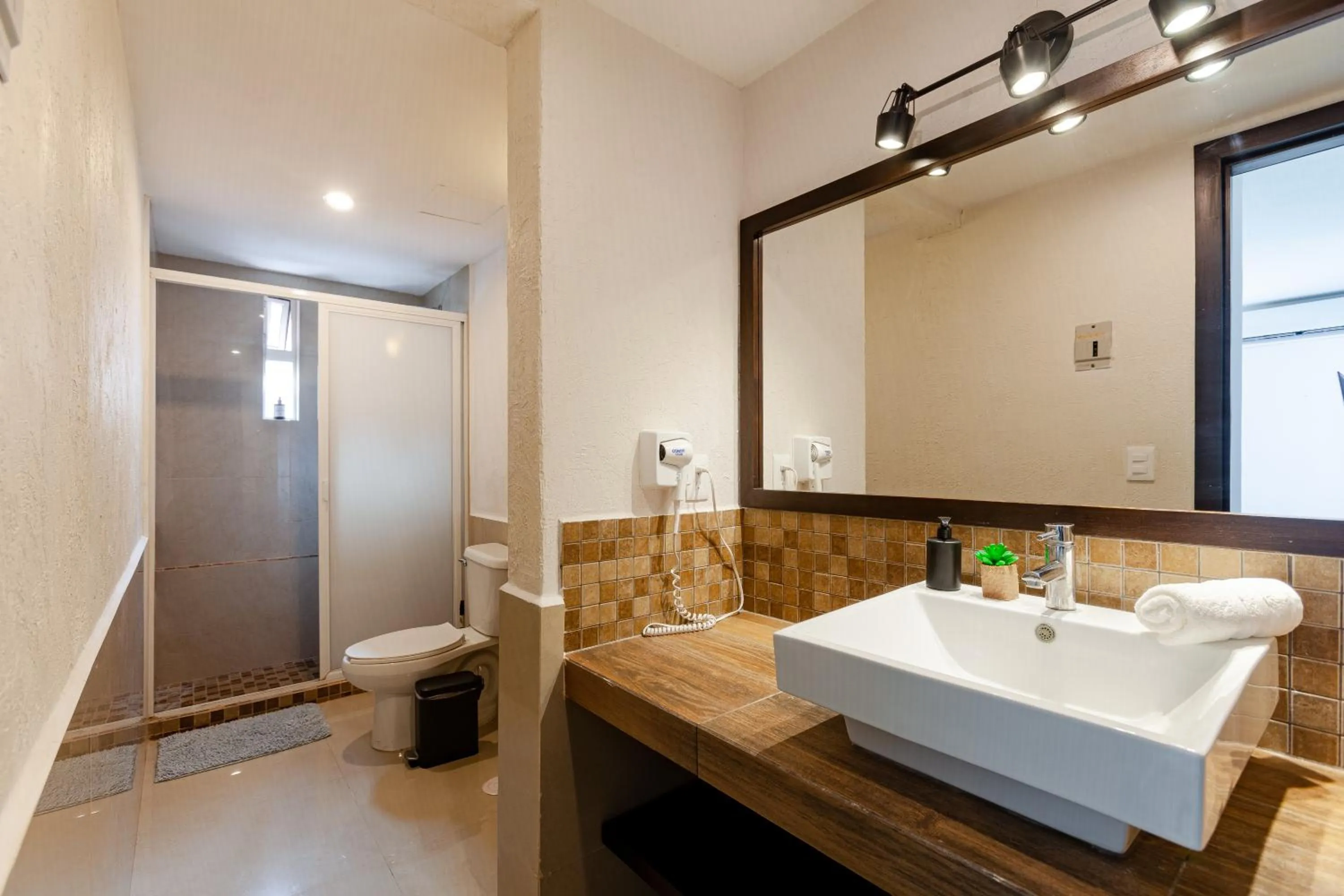 Shower in Via Tendenza Condos