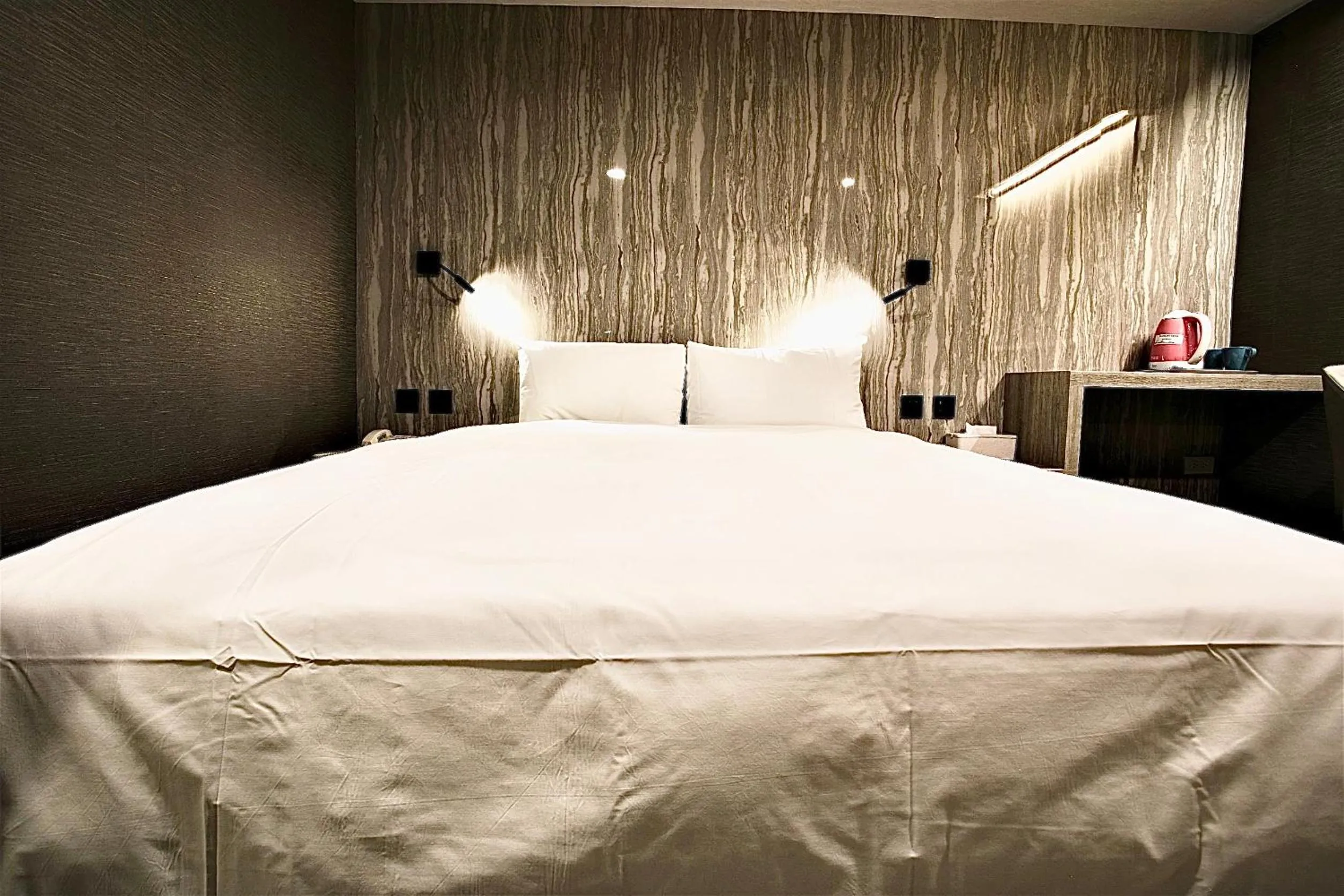 Bed in Golden Home Hotel