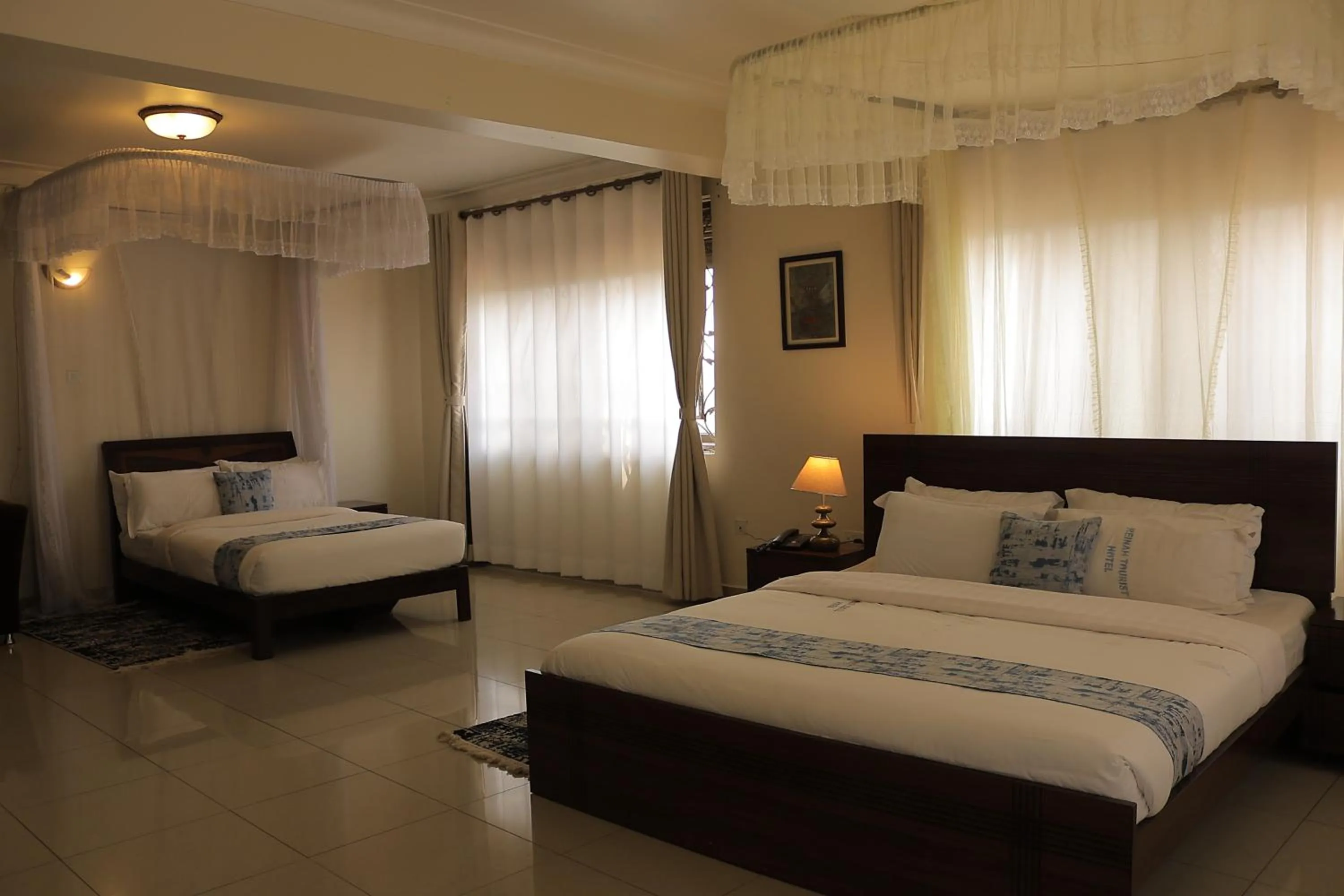 Photo of the whole room, Bed in Reinah Tourist Hotel