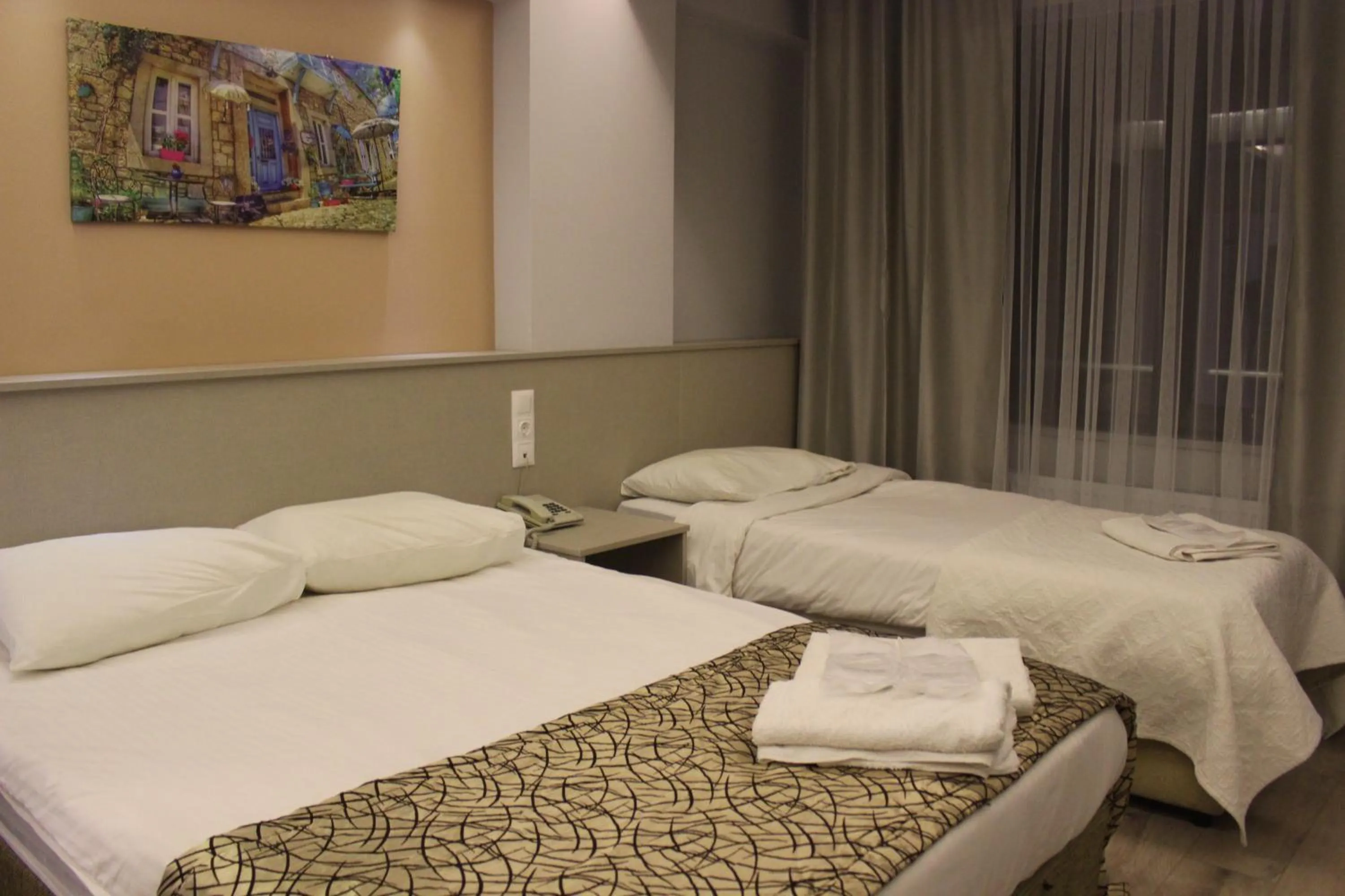 Bed in The Corner Inn Hotels By Suit