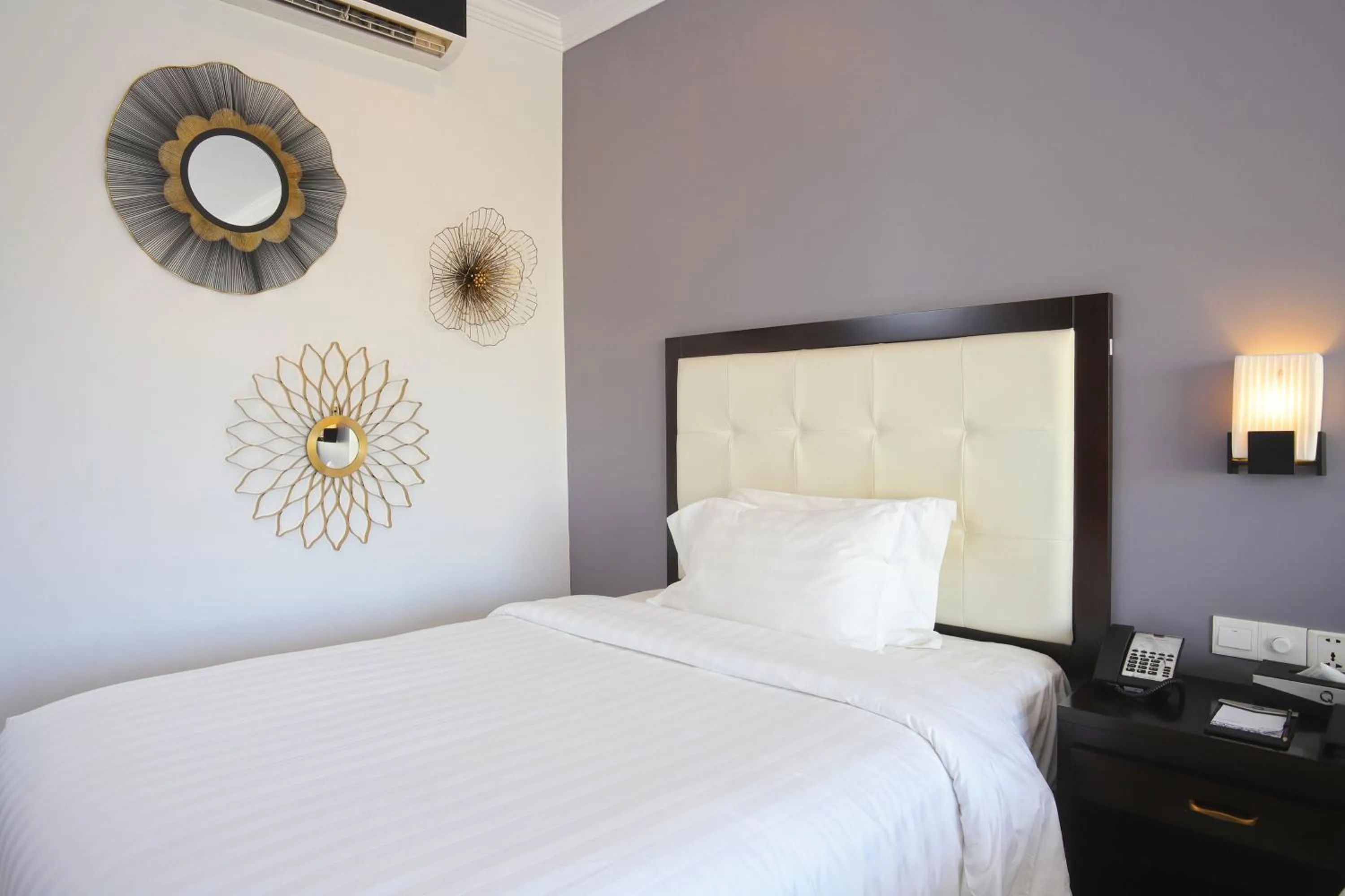 Bed in Queenco Hotel & Casino