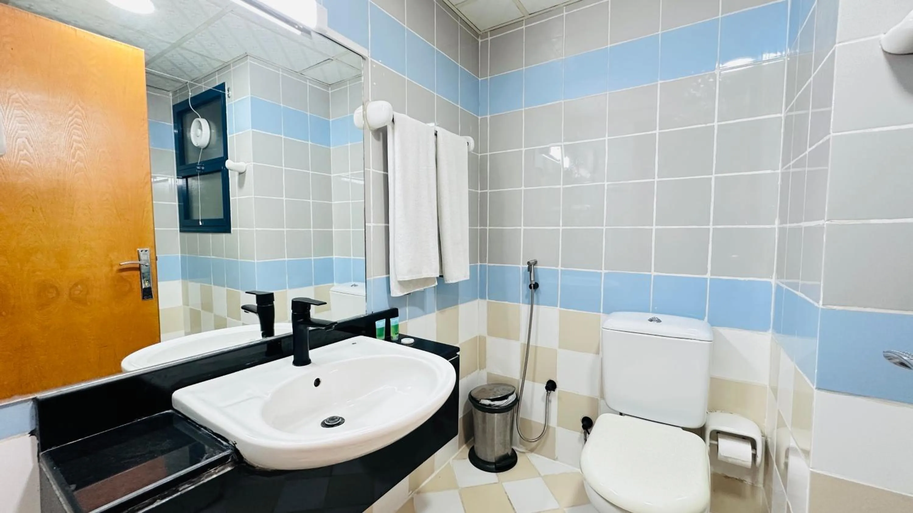 Toilet in Collection O San Marino Hotel