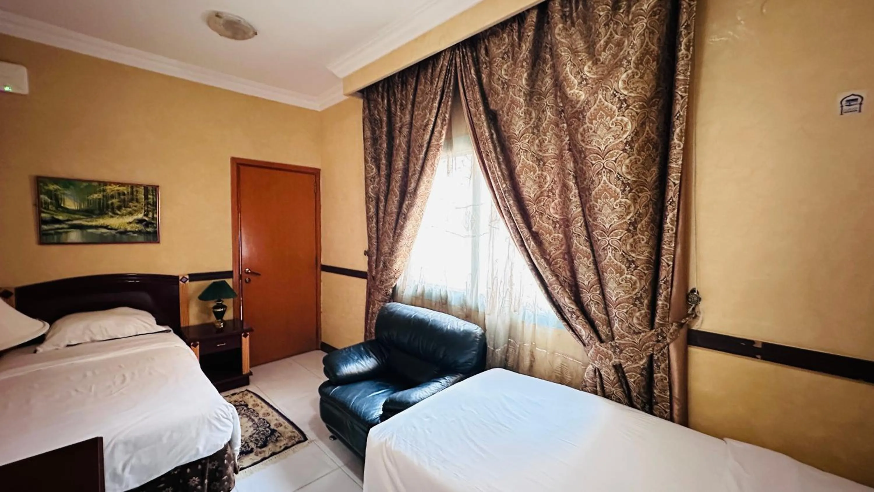 Photo of the whole room, Bed in Collection O San Marino Hotel