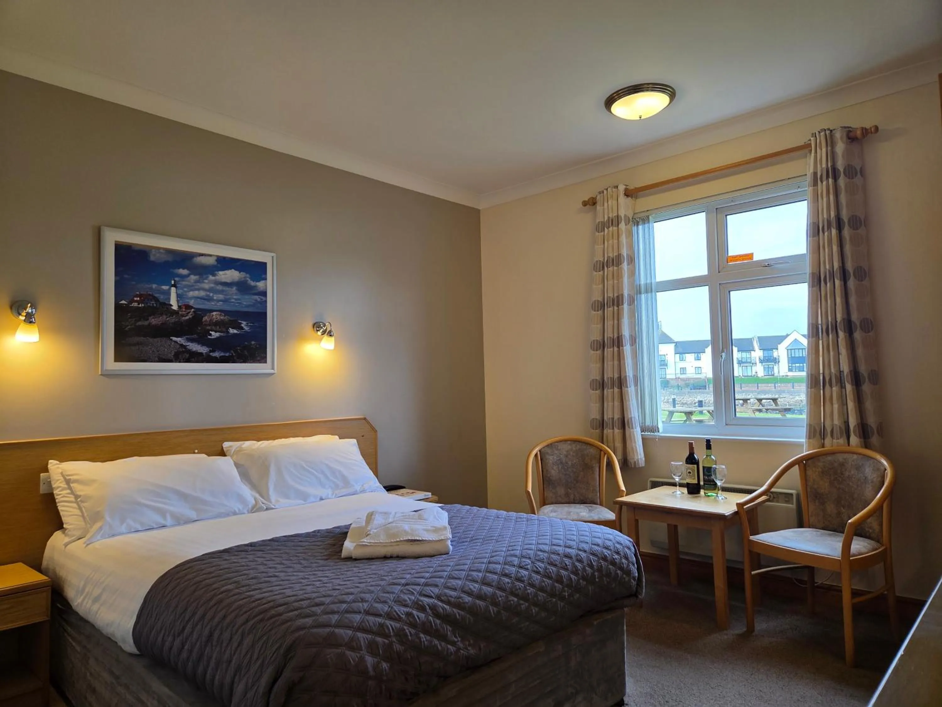 Bed in The Little Haven Hotel On The Beach