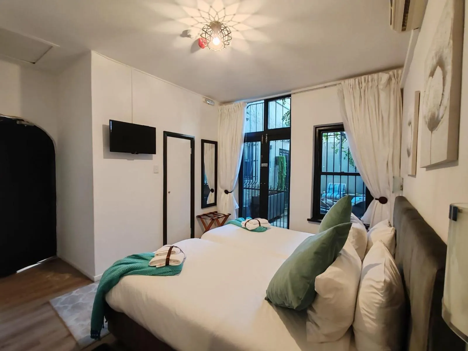 Shower, Bed in Point B Guest House -Sustainable Solar Energy