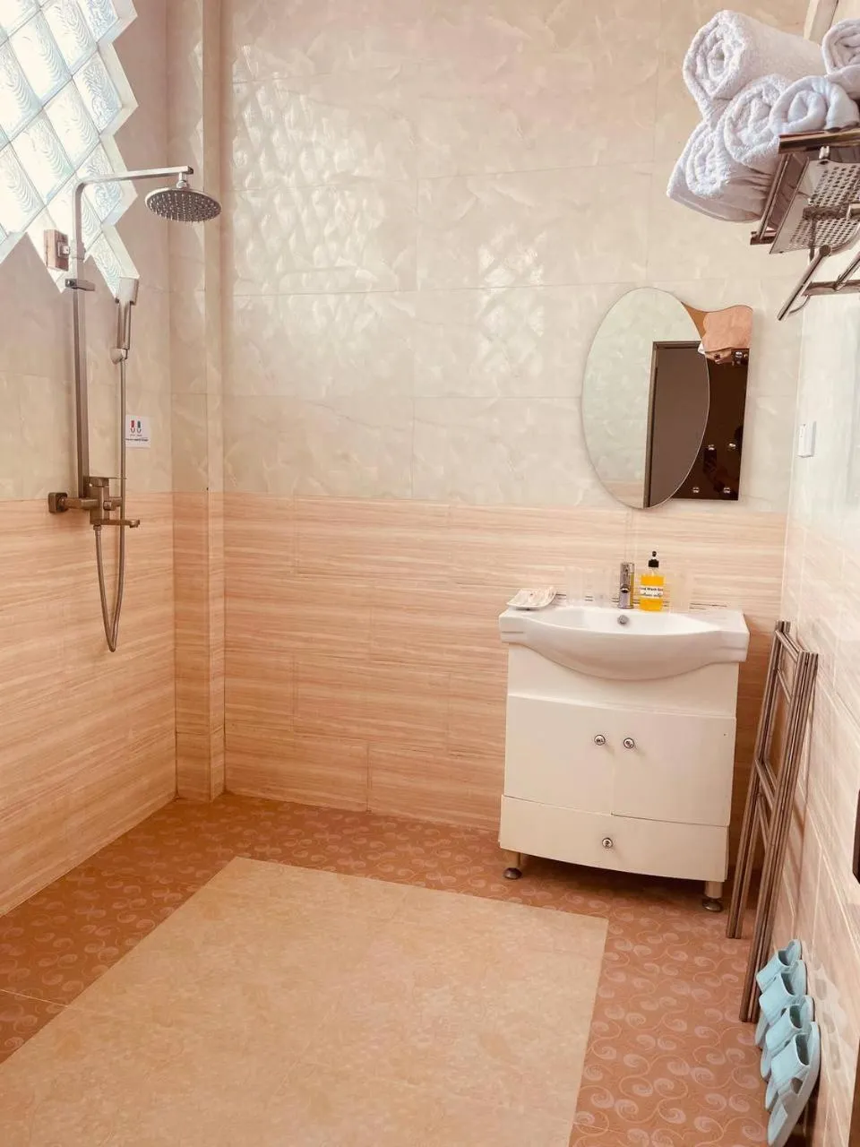 Shower in YAMA HOTEL & ROOFTOP BAR