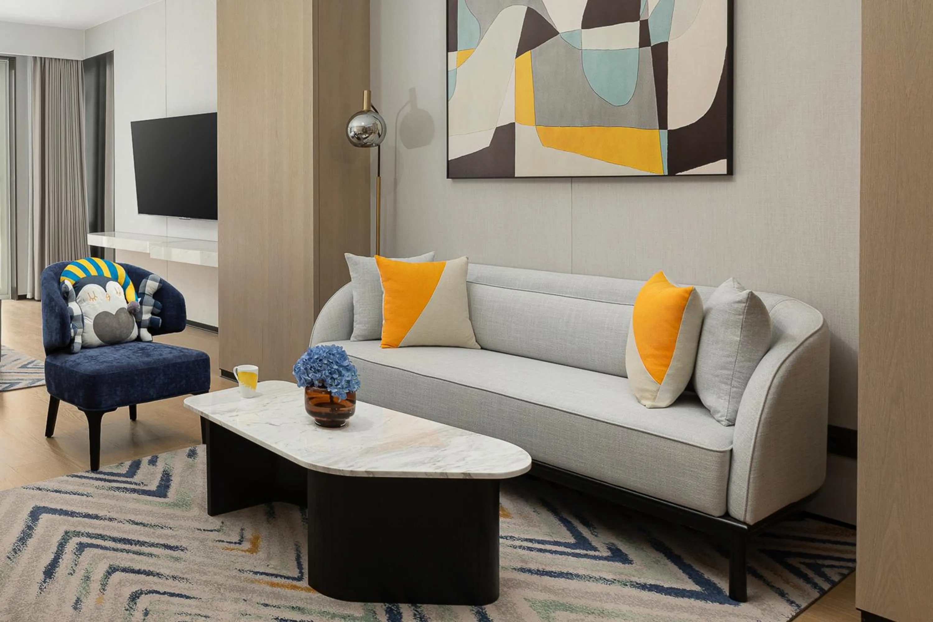 Living room in voco Lianyungang Haizhou Bay by IHG