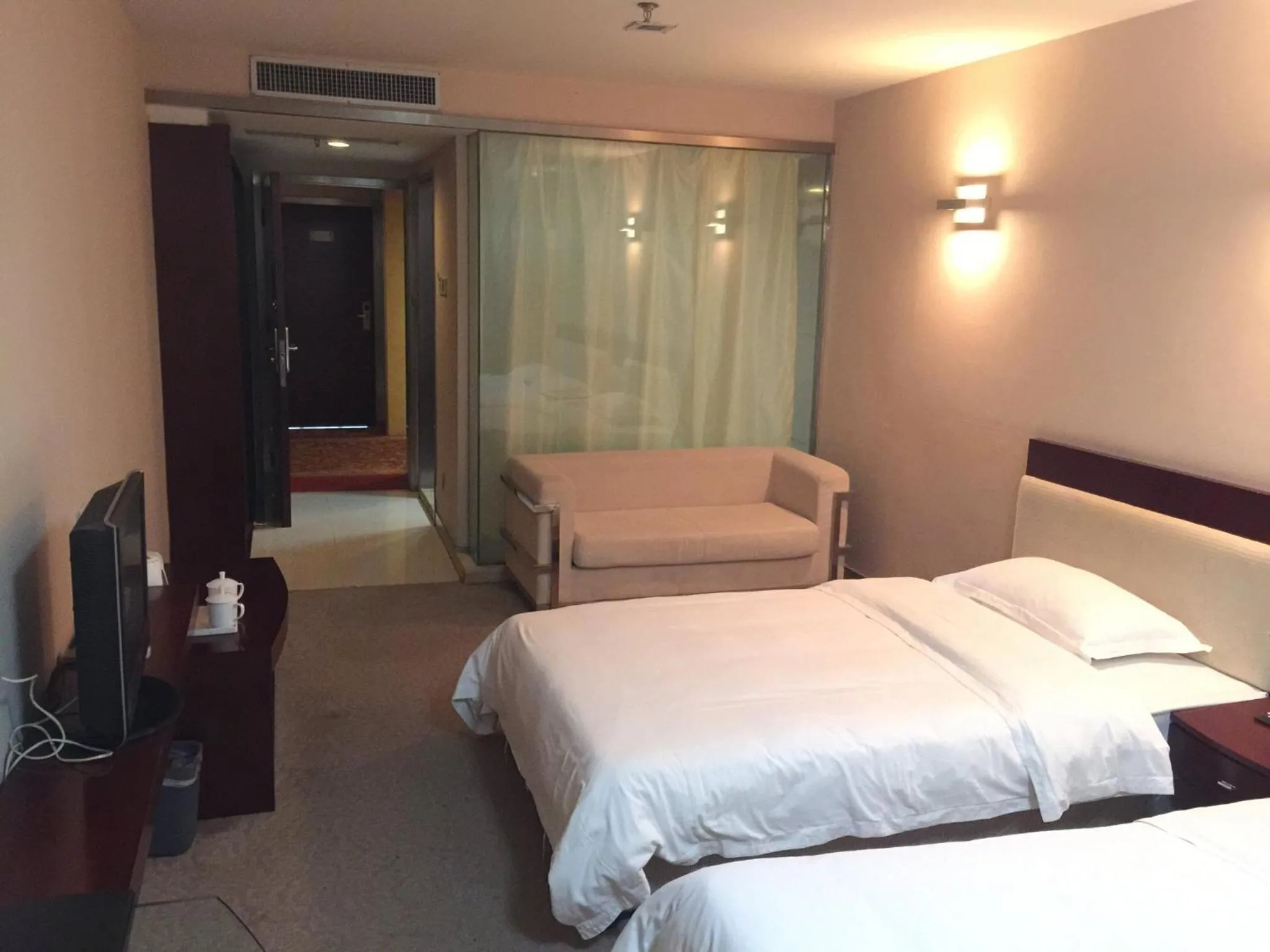 Bed in Ramada Encore by Wyndham Wuhan Int'l Conference Center