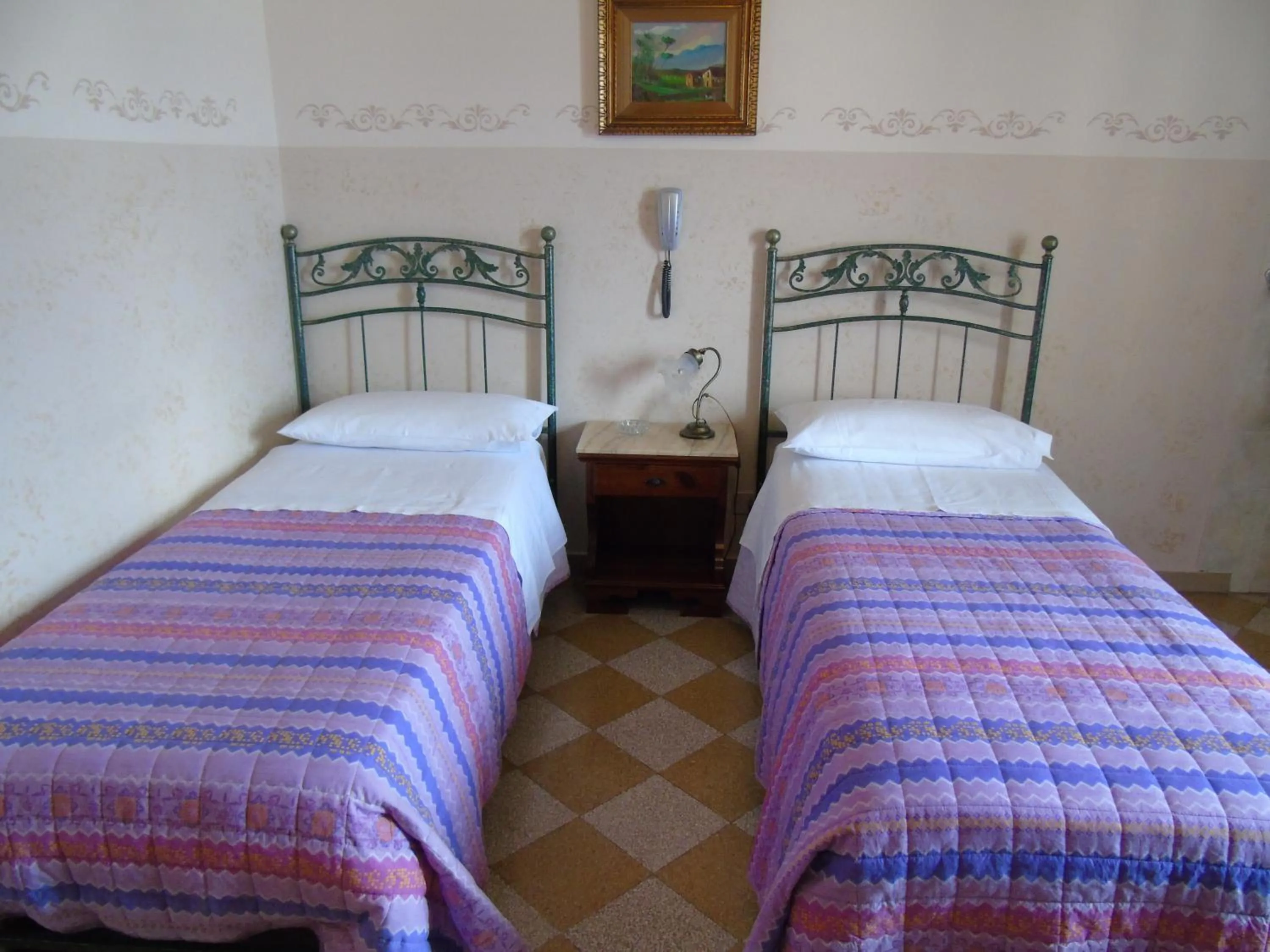 Bed in Albergo Cavour