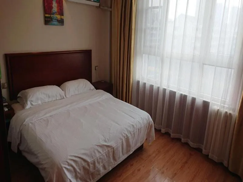 Bed in GreenTree Inn Shandong Jining Jinxiang Kuixing Road Express Hotel