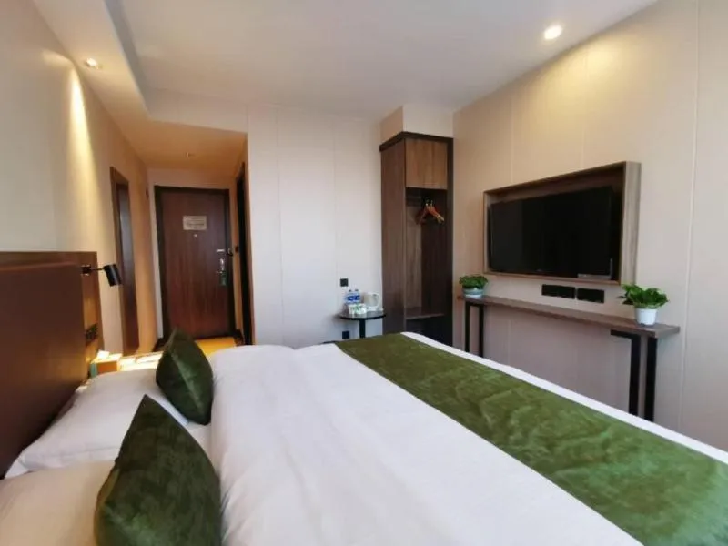 Bed in GreenTree Inn Anhui Lu’an Huoshan Yingjia Avenue Business Hotel
