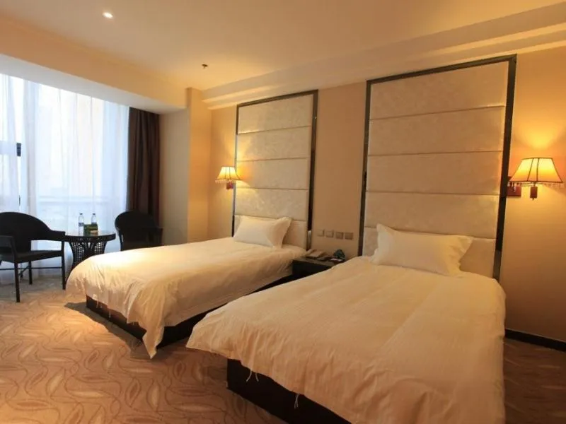 Bed in GreenTree Inn ShanDong North WeiHai StationNorth International Bathing Beach Business Hotel