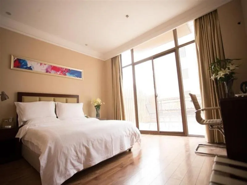 Bed in GreenTree Inn Hubei Huanggang Hong An Wal-Mart Plaza Business Hotel