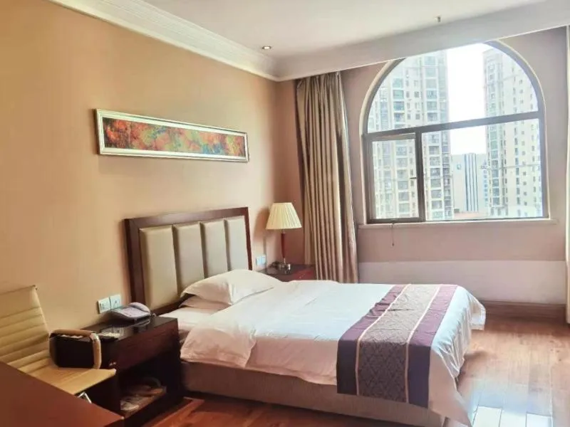 Bed in GreenTree Inn Hubei Huanggang Hong An Wal-Mart Plaza Business Hotel