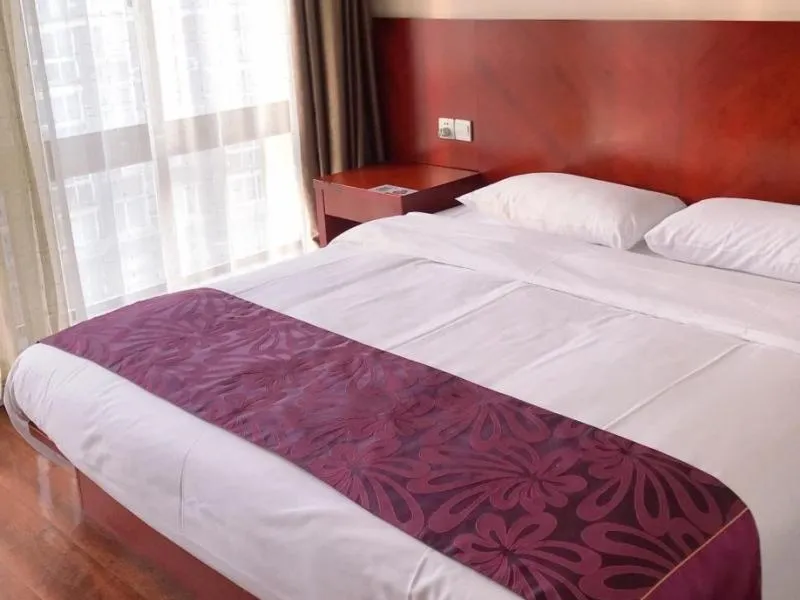 Bed in GreenTree Inn Jiangsu Wuxi Jiangyin Lingang New City Shengang Express Hotel
