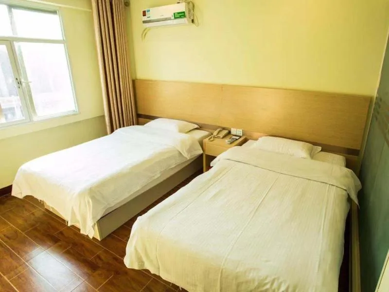 Bed in GreenTree Inn Jiangsu Nantong Haimen Bus Statian Shell Hotel